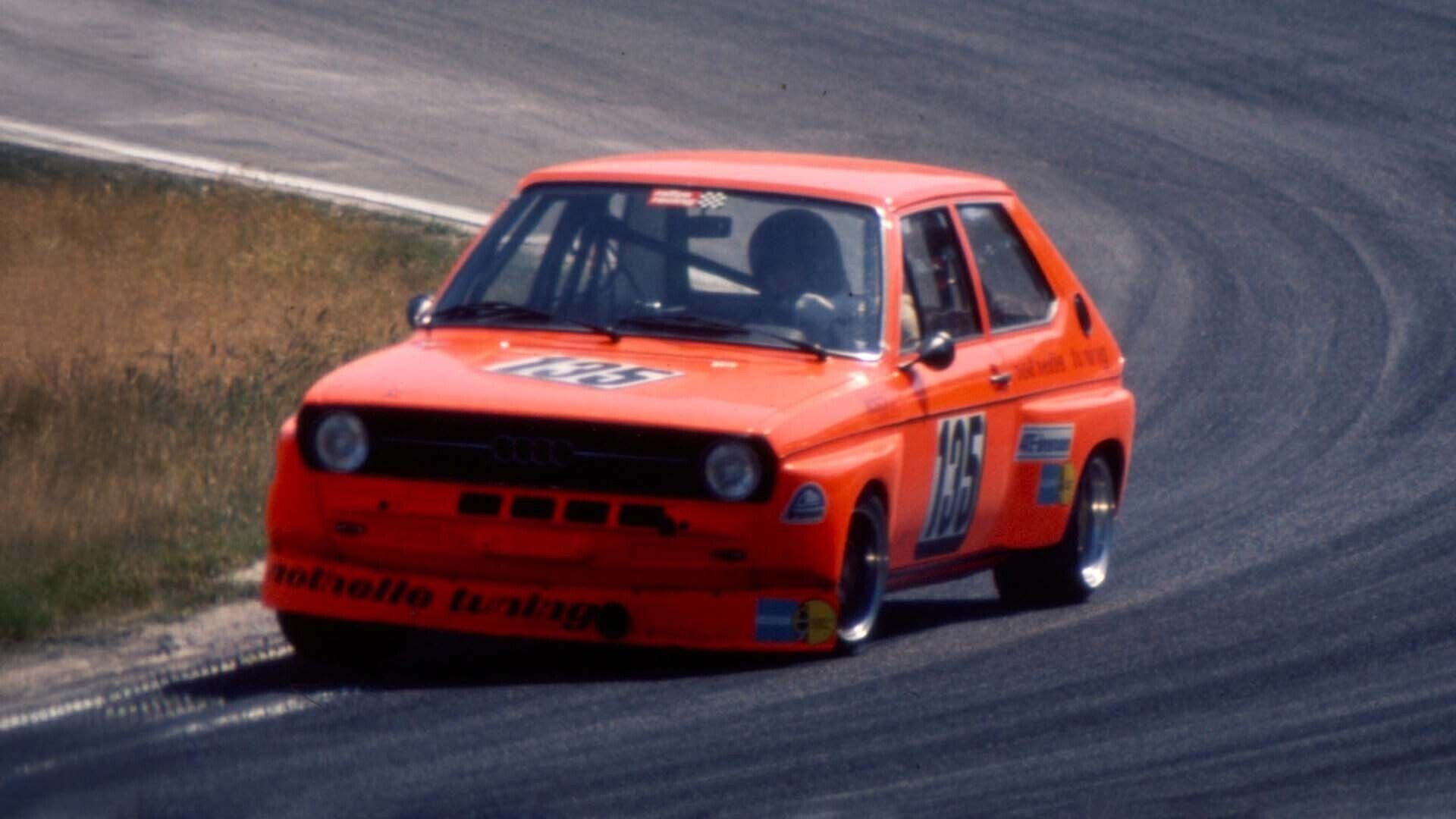 A picture showing an Audi 50 race car on track.