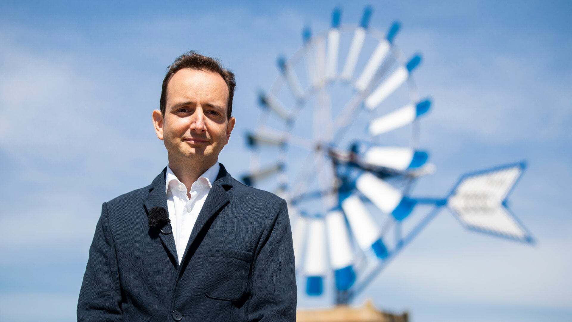 Audi developer Francisco Trigueros Morera de la Vall in front of a windmill