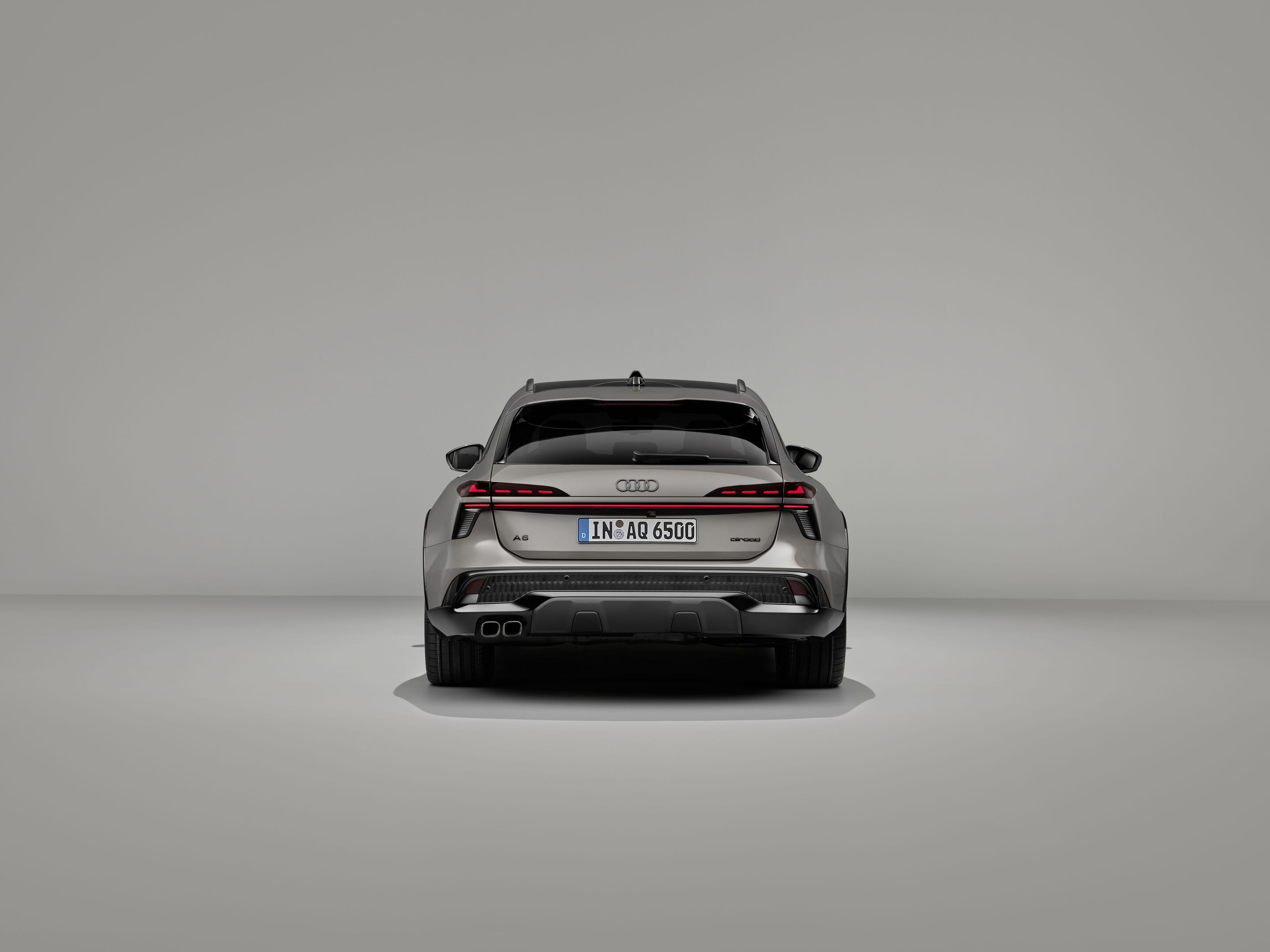 Audi A6 allroad quattro - Audi A6 allroad (plateau grey metallic) in a rear view: The digital OLED rear lights 2.0 and the powerful diffuser underline the presence at the rear.