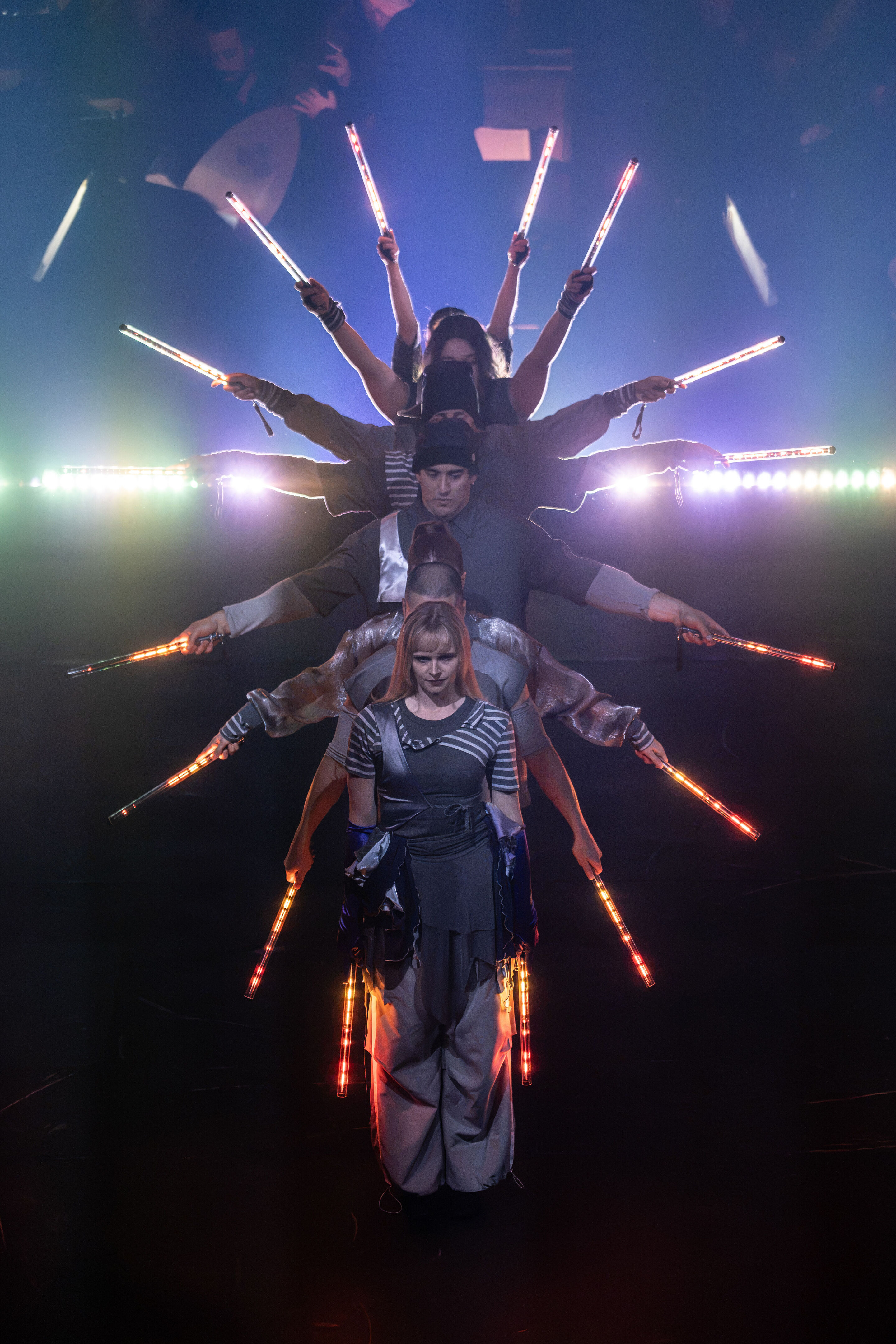 Audi Summer concert: Performance of “Dido and Aeneas” featuring Flying Steps at the Festsaal Ingolstadt - Six dancers from the Flying Steps dance company stand in a line, one behind the other, holding illuminated light batons aloft. Their symmetrical...