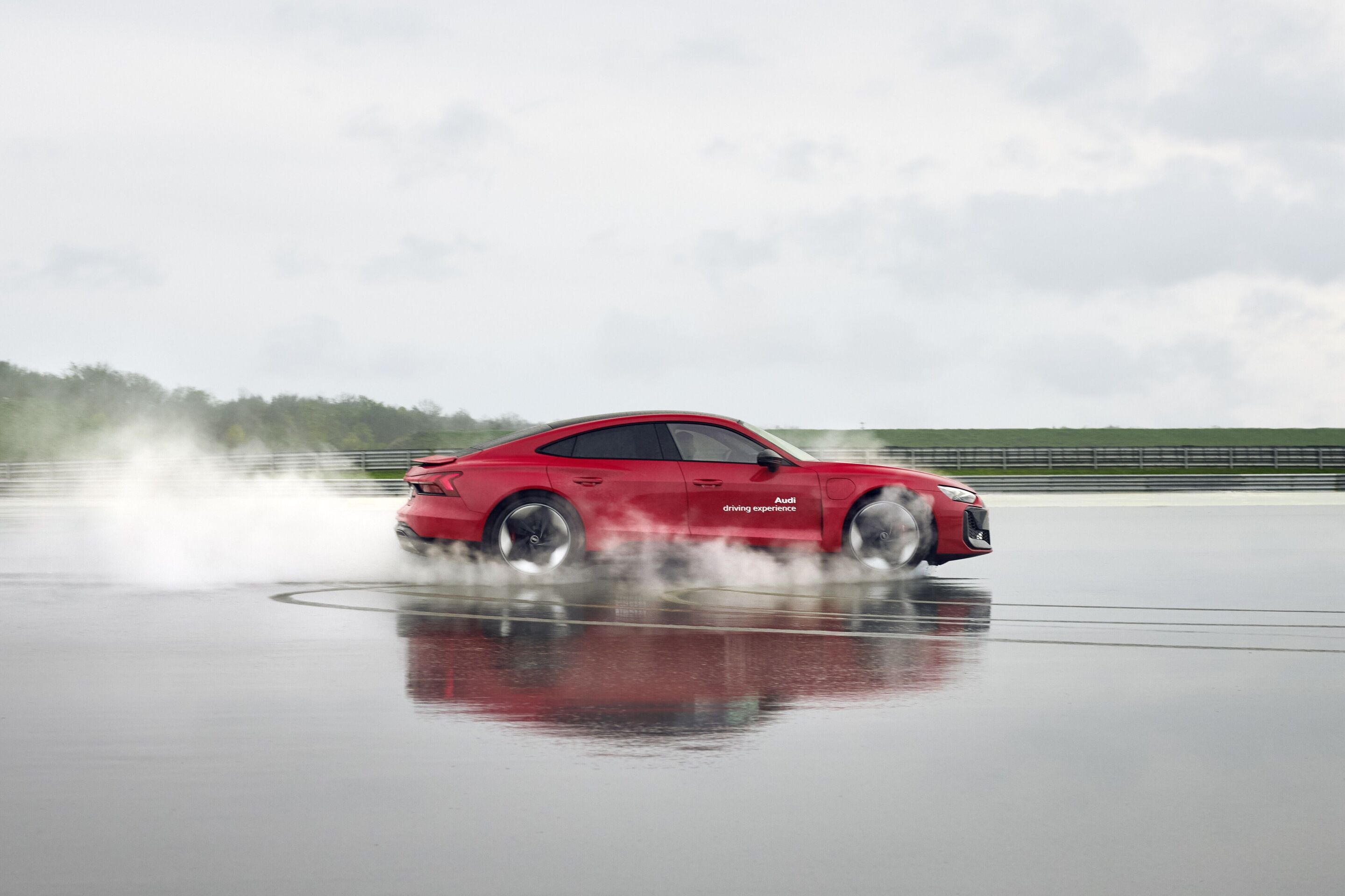 Audi driving experience - Audi RS e-tron GT on a wetted dynamic driving surface.
