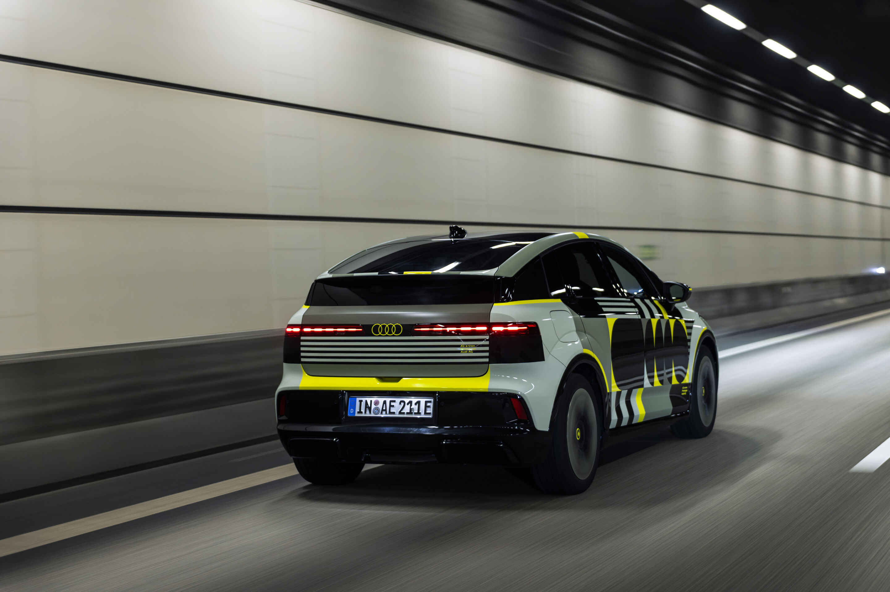 Audi A2 e-tron with design livery - Outdoor driving shot, exterior, three-quarter rear view