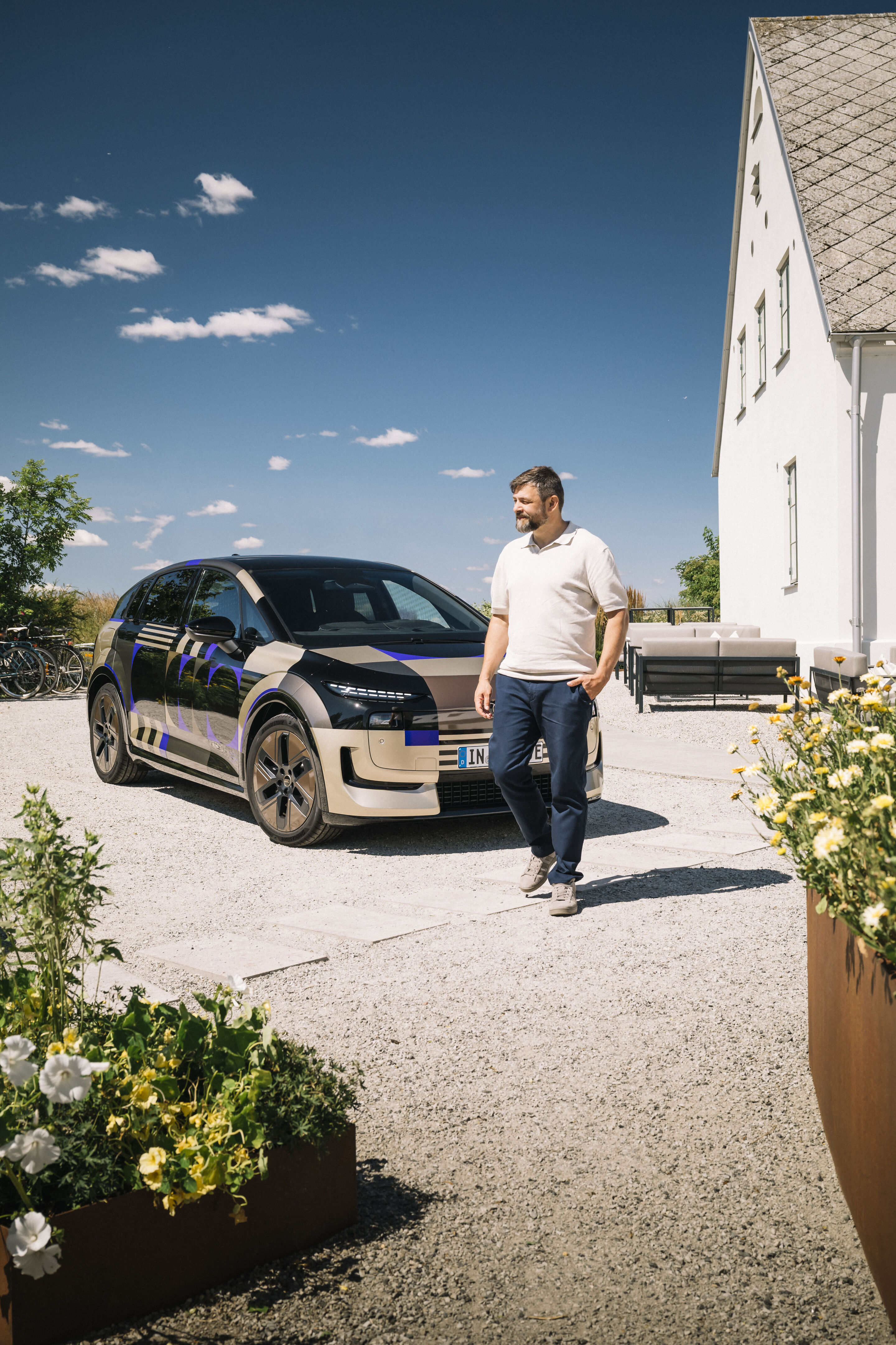 Robby Pyttel in front of the Audi A2 e-tron with design livery - Lead engineer responsible for the aerodynamics and aeroacoustics development of the Audi A2 e-tron.