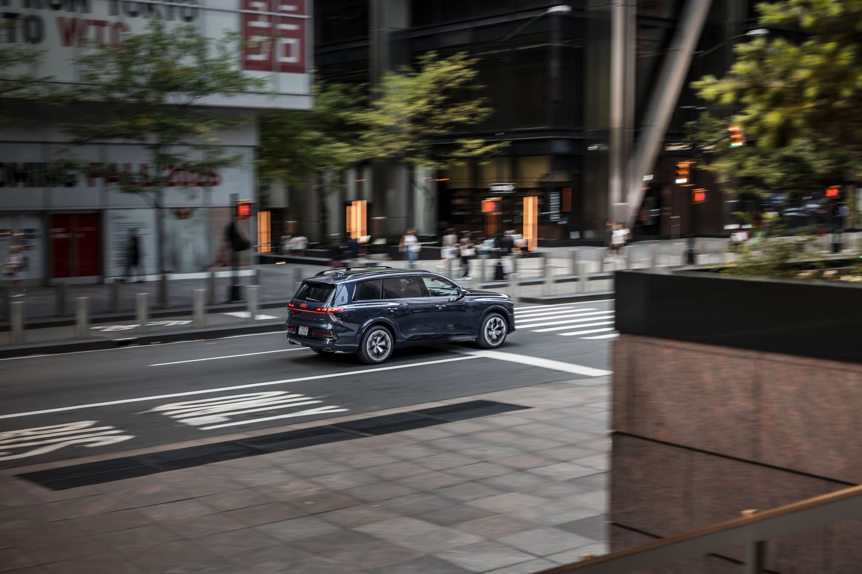 Audi Q9 - Waitomo blue metallic, dynamic photo from New York City