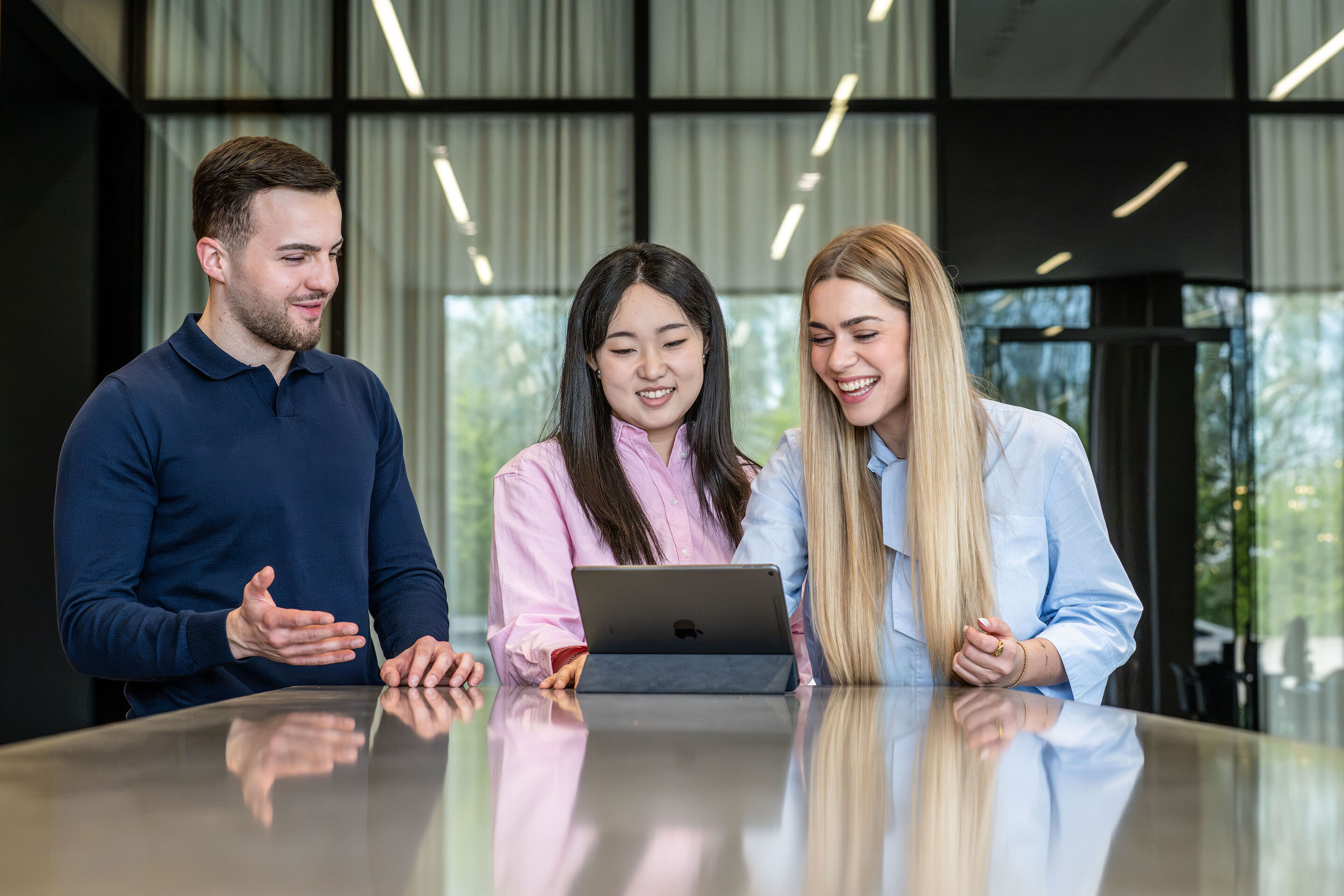 Group of interns - Group of interns working at a desk