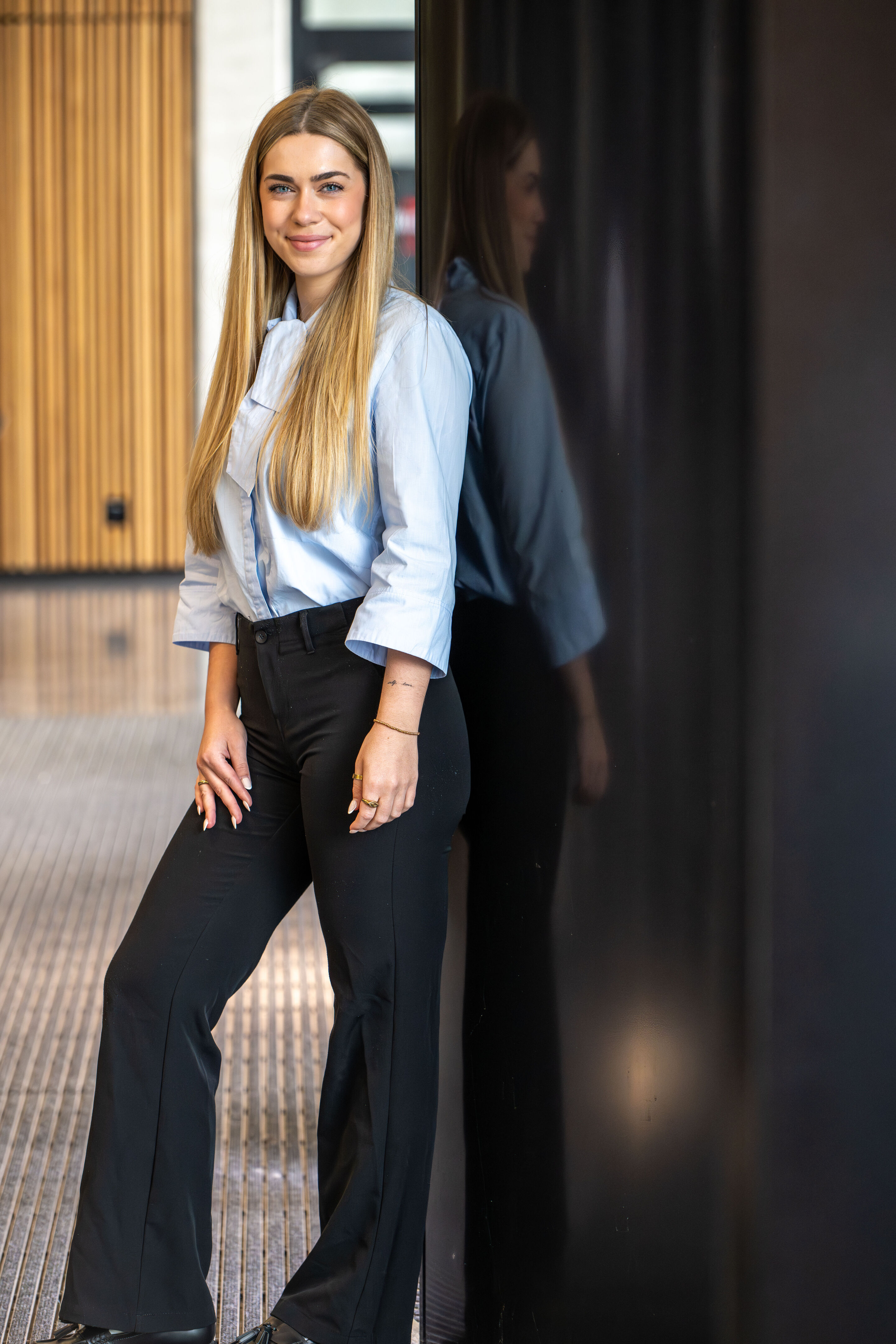 Photo of female intern standing - Photo of female intern standing