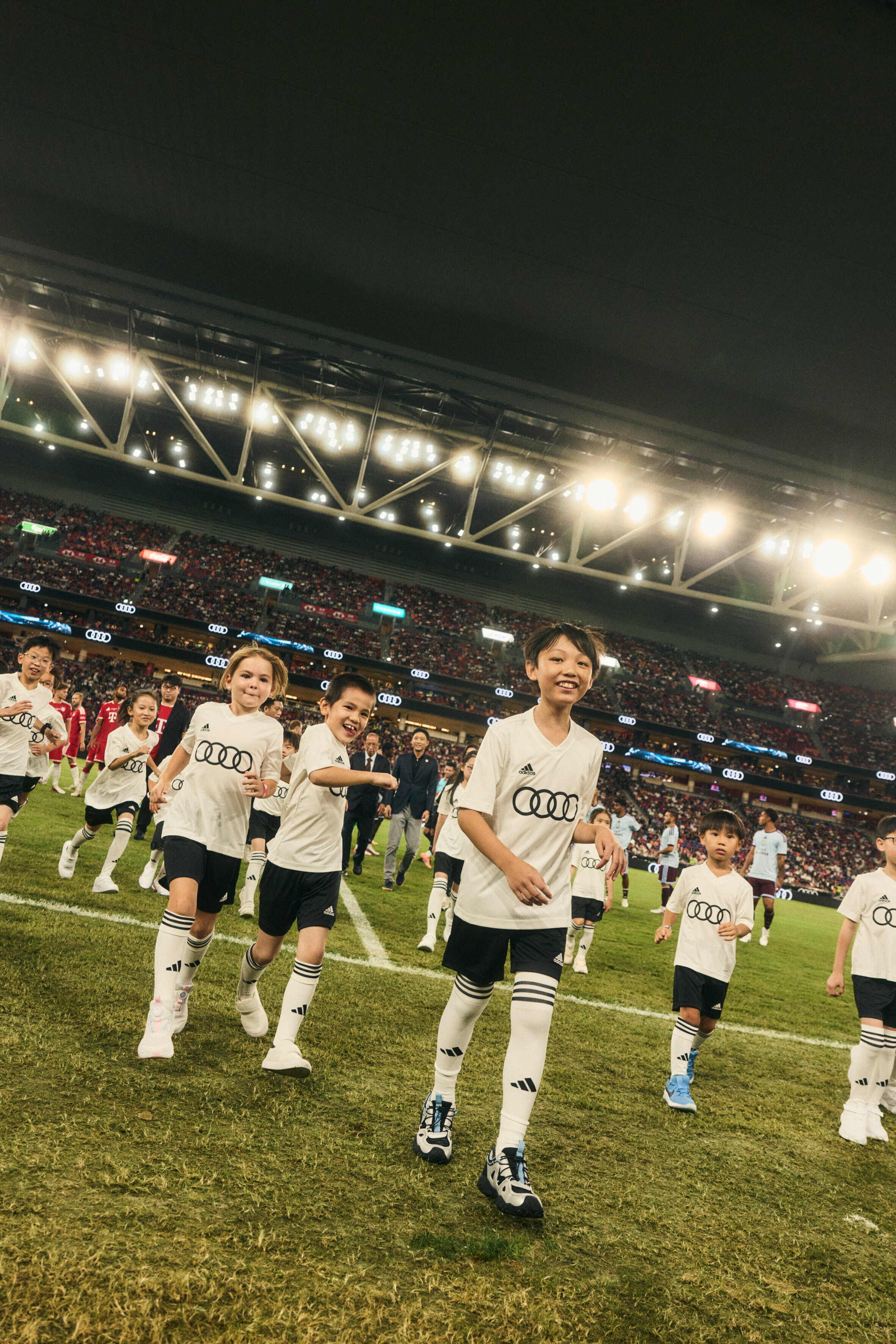 “Audi Summer Tour”: FC Bayern Munich’s anniversary tour of South Korea and Hong Kong - Player escorts at Kai Tak Sports Park in Hong Kong in front of the stadium stands during the Audi Summer Tour.