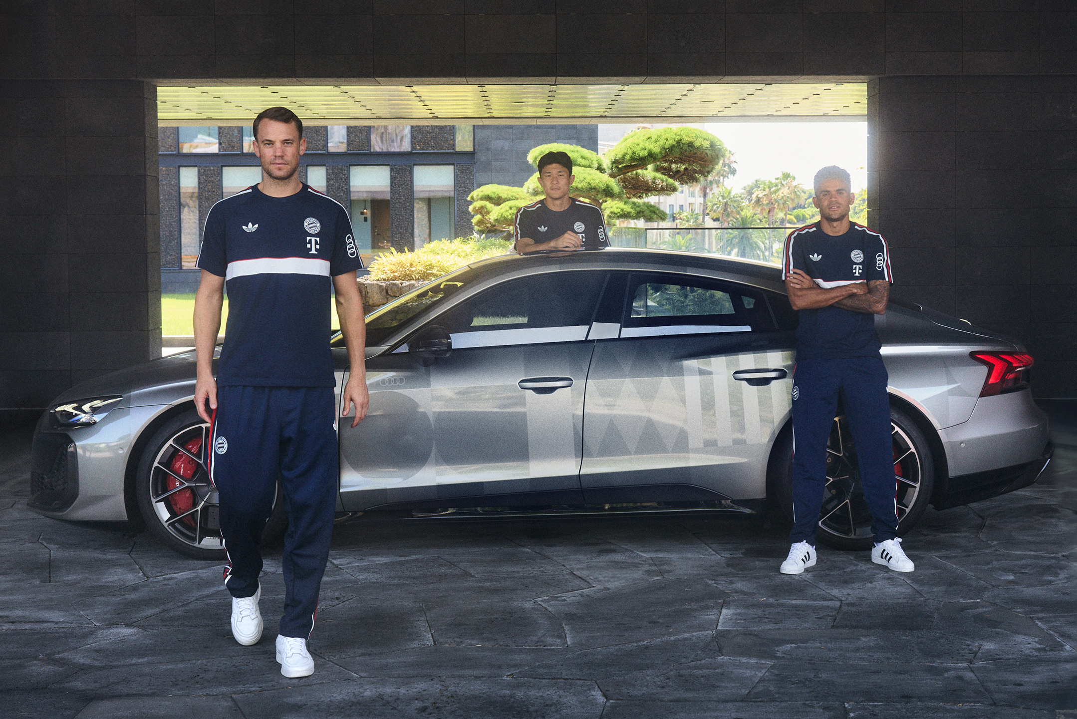 “Audi Summer Tour”: FC Bayern Munich’s anniversary tour of South Korea and Hong Kong - From left: Manuel Neuer, Minjae Kim and Luis Diaz in front of the Audi RS e-tron GT FC Bayern Concept with design livery, outdoor static shot, exterior, side view,...