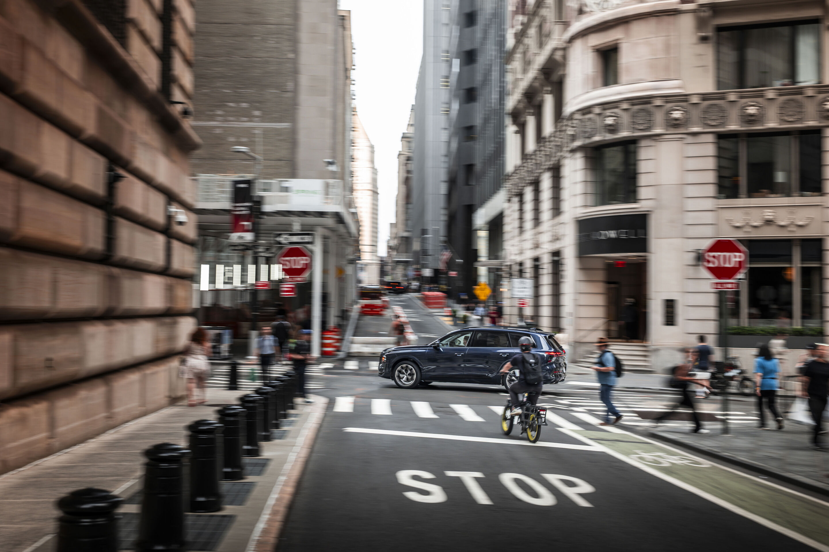 Audi Q9 SUV - Audi Q9 SUV — Waitomo blue metallic, dynamic photo in New York City. The image shows a US-specification model.