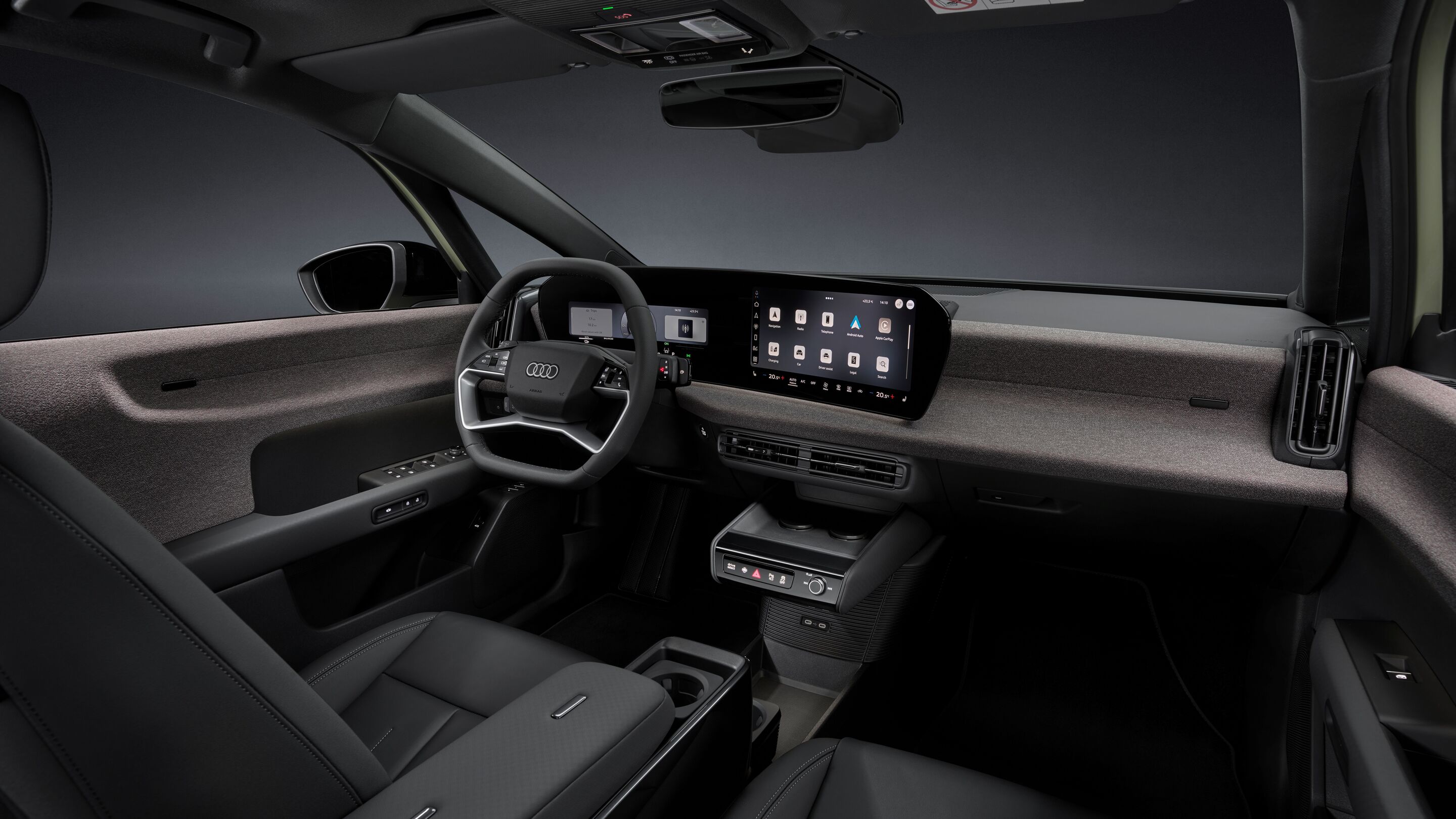 Audi A2 e-tron - Studio static photo, interior, cockpit from the passenger side, multifunction steering wheel, MMI panoramic display, MMI touch display, fabric-covered surface softwrap, centre armrest with modular Fidlock fastening system and phone tray...