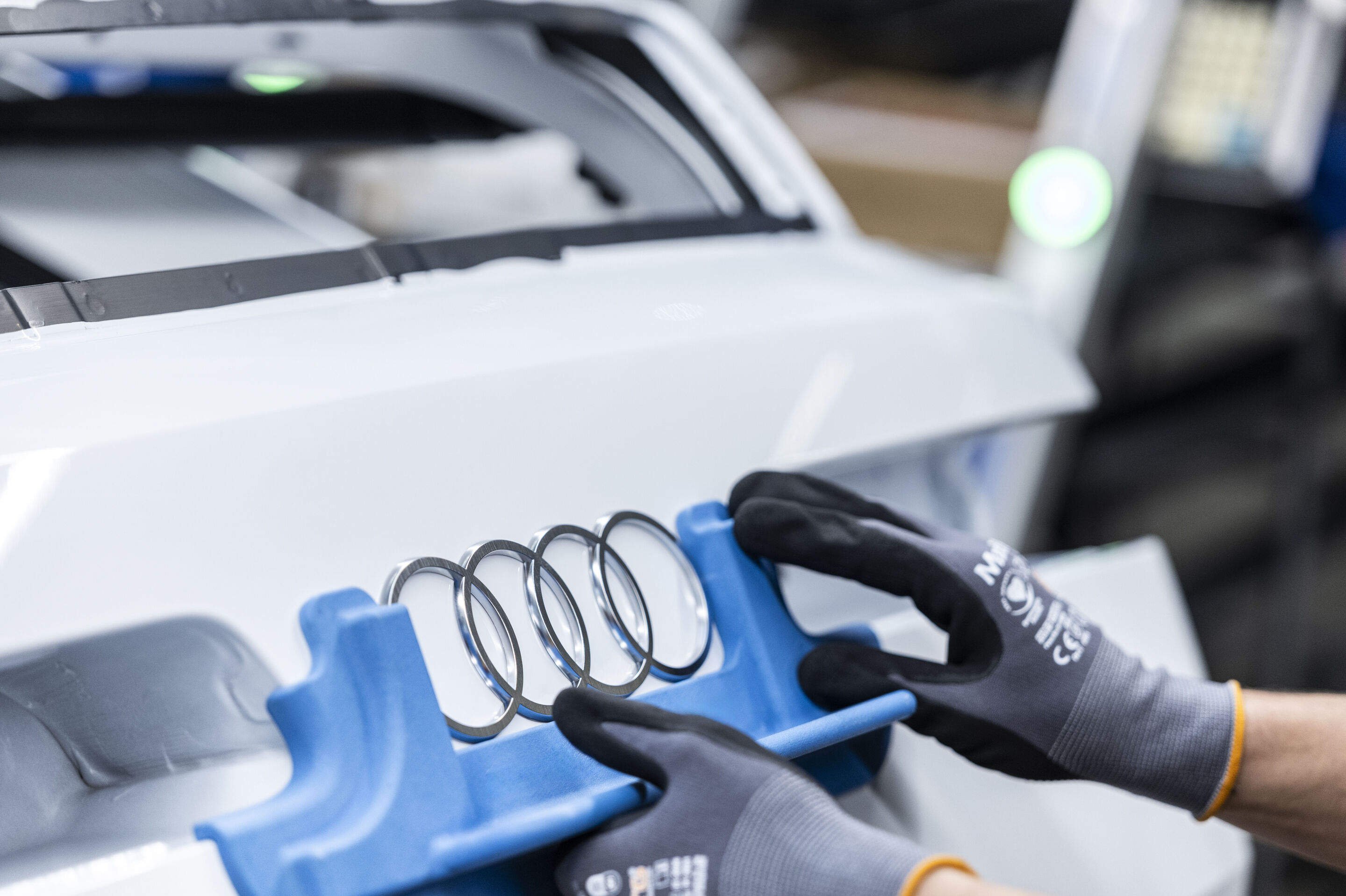 Audi A2 e-tron production at the Ingolstadt site - Installation of the Audi rings on the Audi A2 e-tron.
