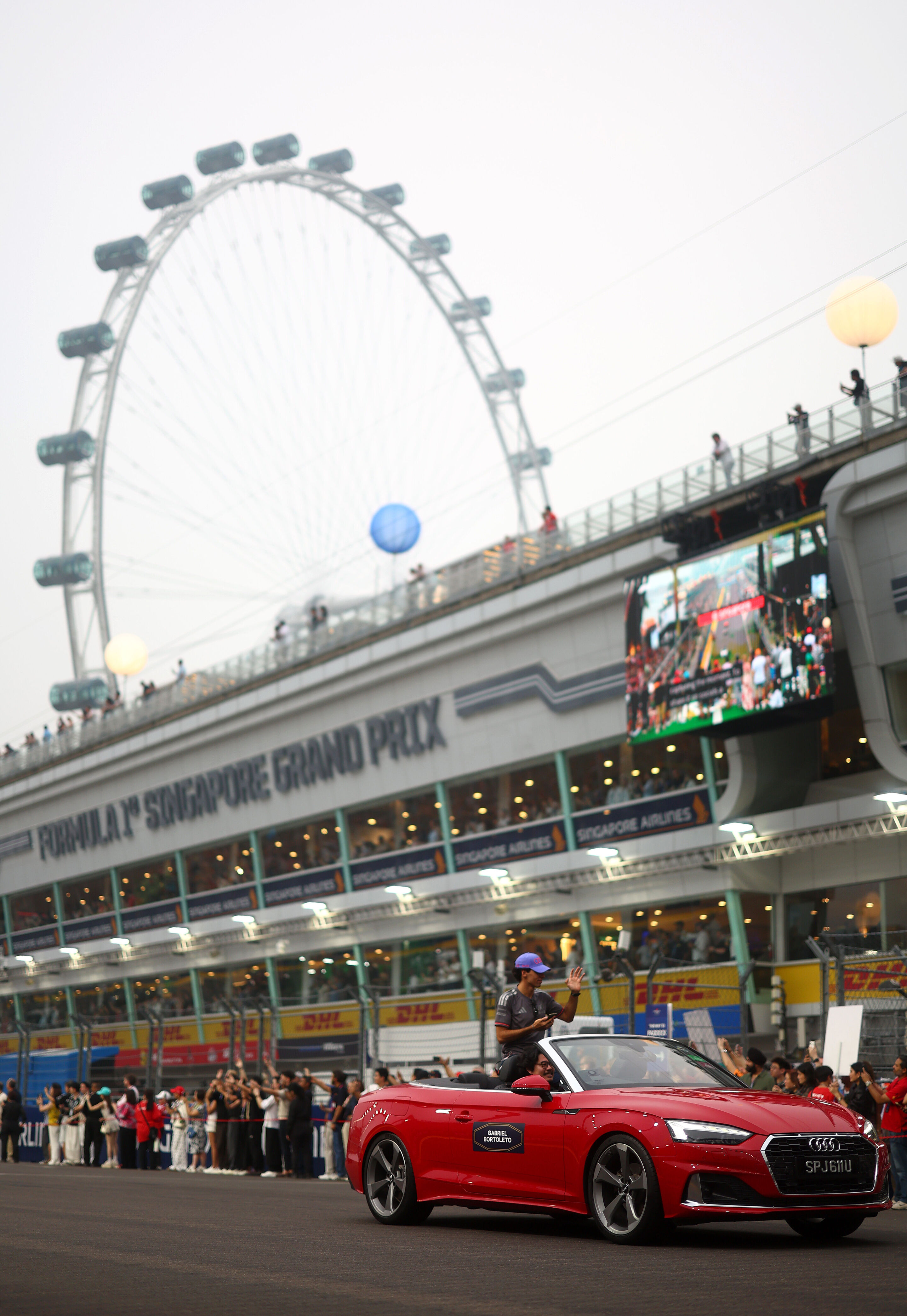 Audi Revolut F1 Team: Singapore Grand Prix - Gabriel Bortoleto during the drivers presentation with an Audi A5 Cabriolet