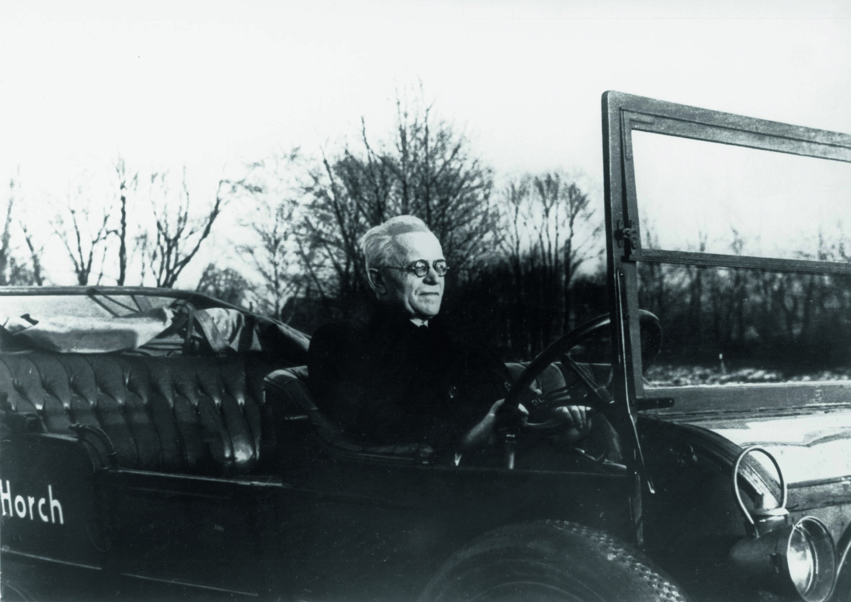 Anniversary magazine History - August Horch, photographed in the 1930s with one of his first cars