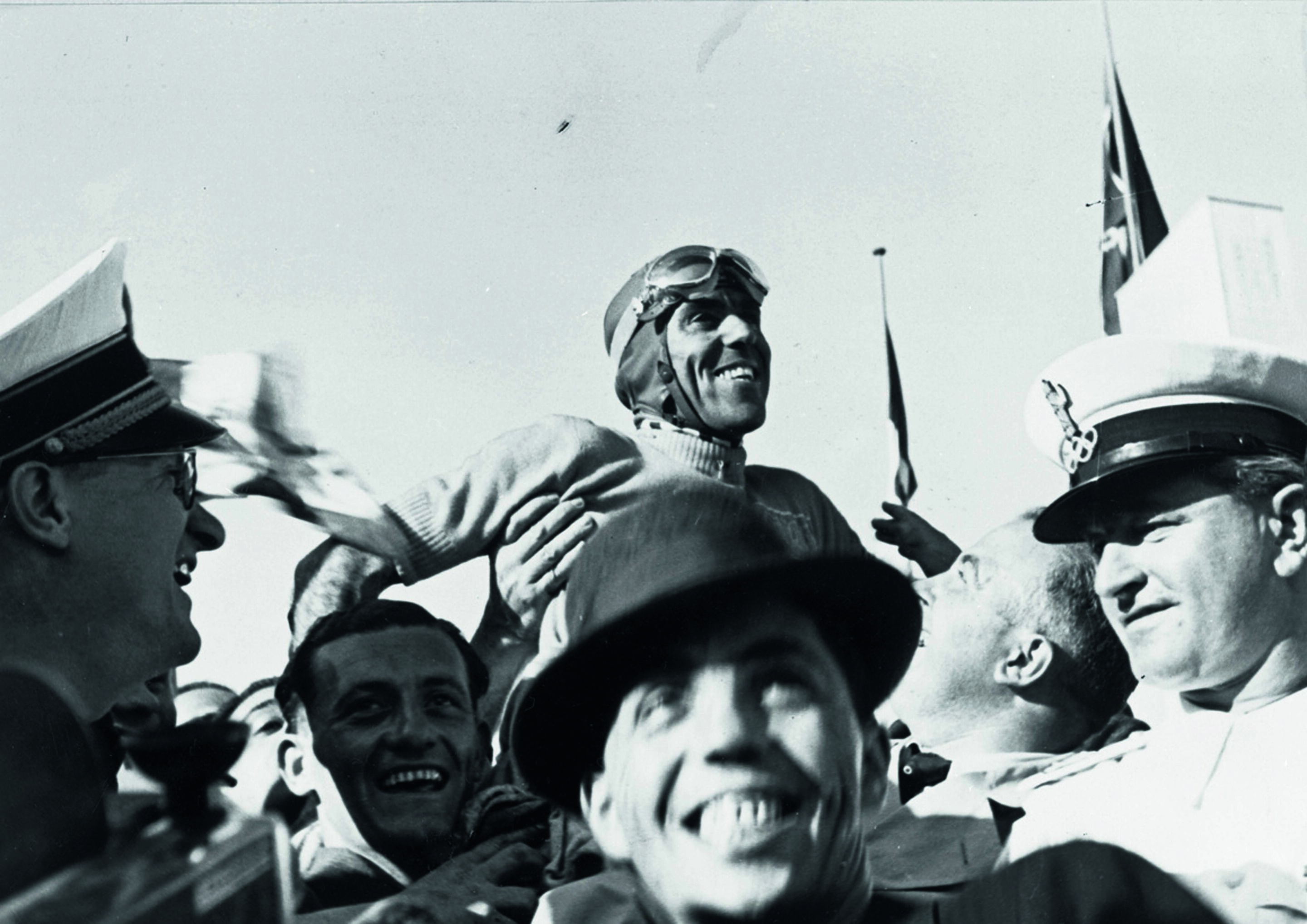 Anniversary magazine Motorsports - Monza 1938 - Tazio Nuvolari following victory in his home race with the Type D.