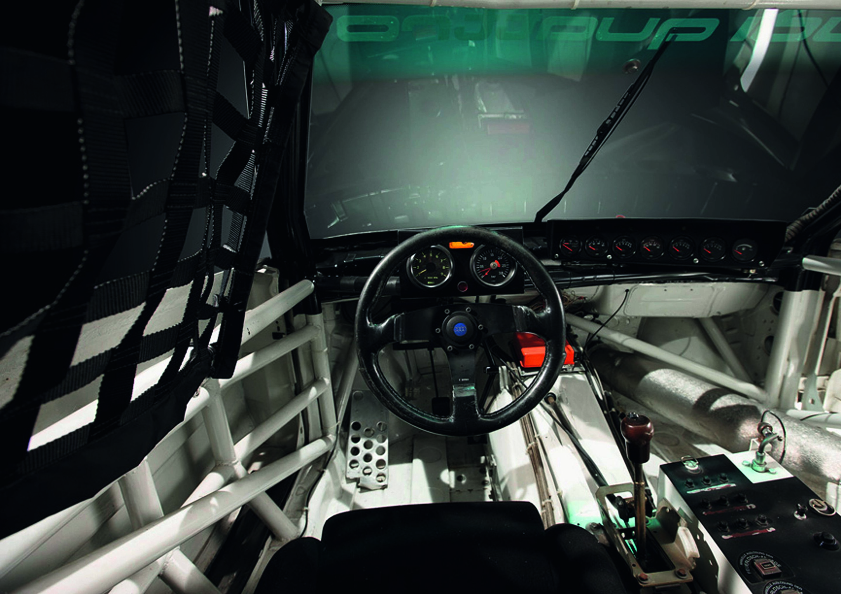 Anniversary magazine Motorsports - Audi 200 TransAm - large charge-pressure dial and rev counter; the exhaust runs through the inside of the car.