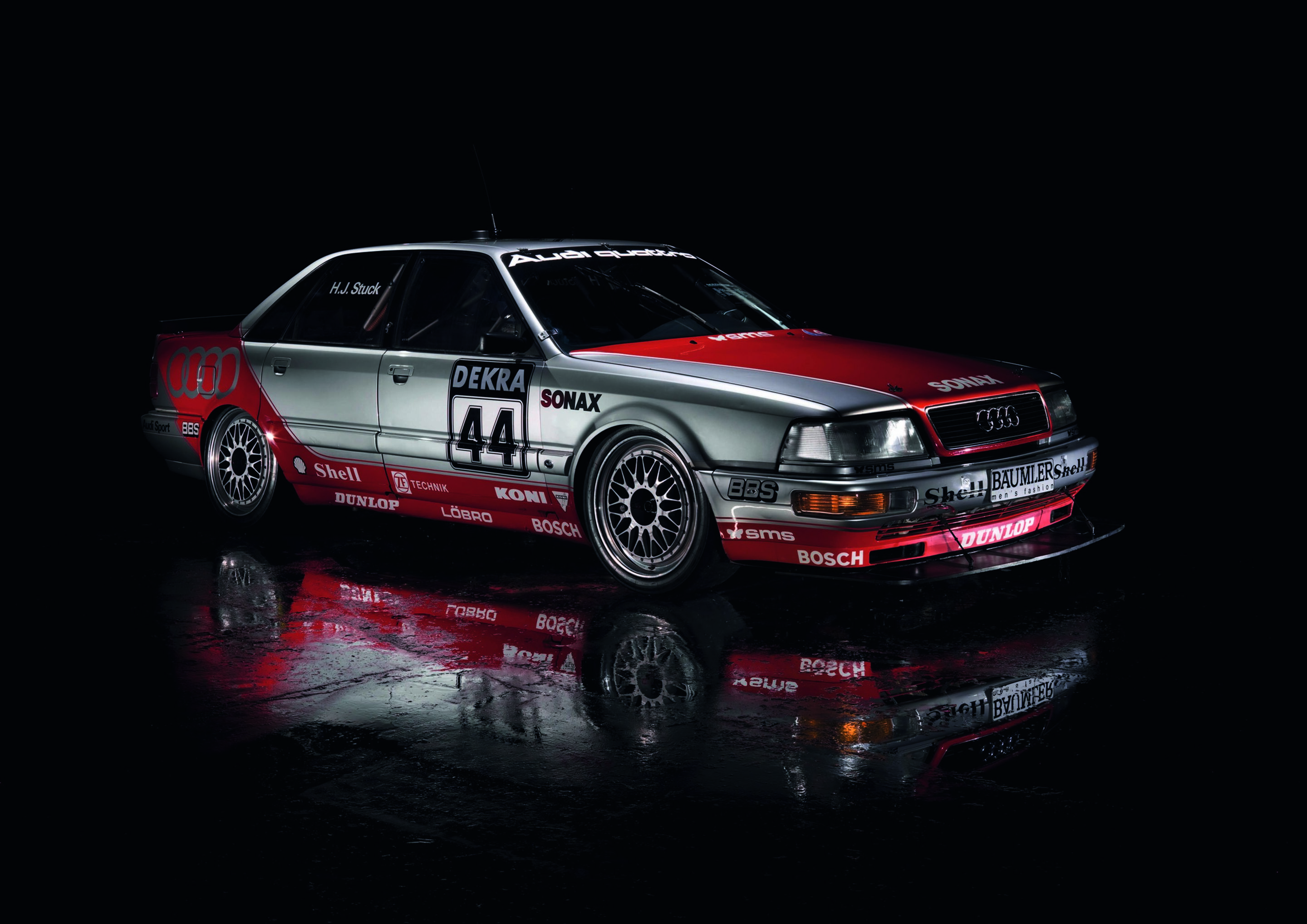 Anniversary magazine Motorsports - Audi V8 DTM, 1992 season - red and silver paintwork, an extra large spoiler at the front.