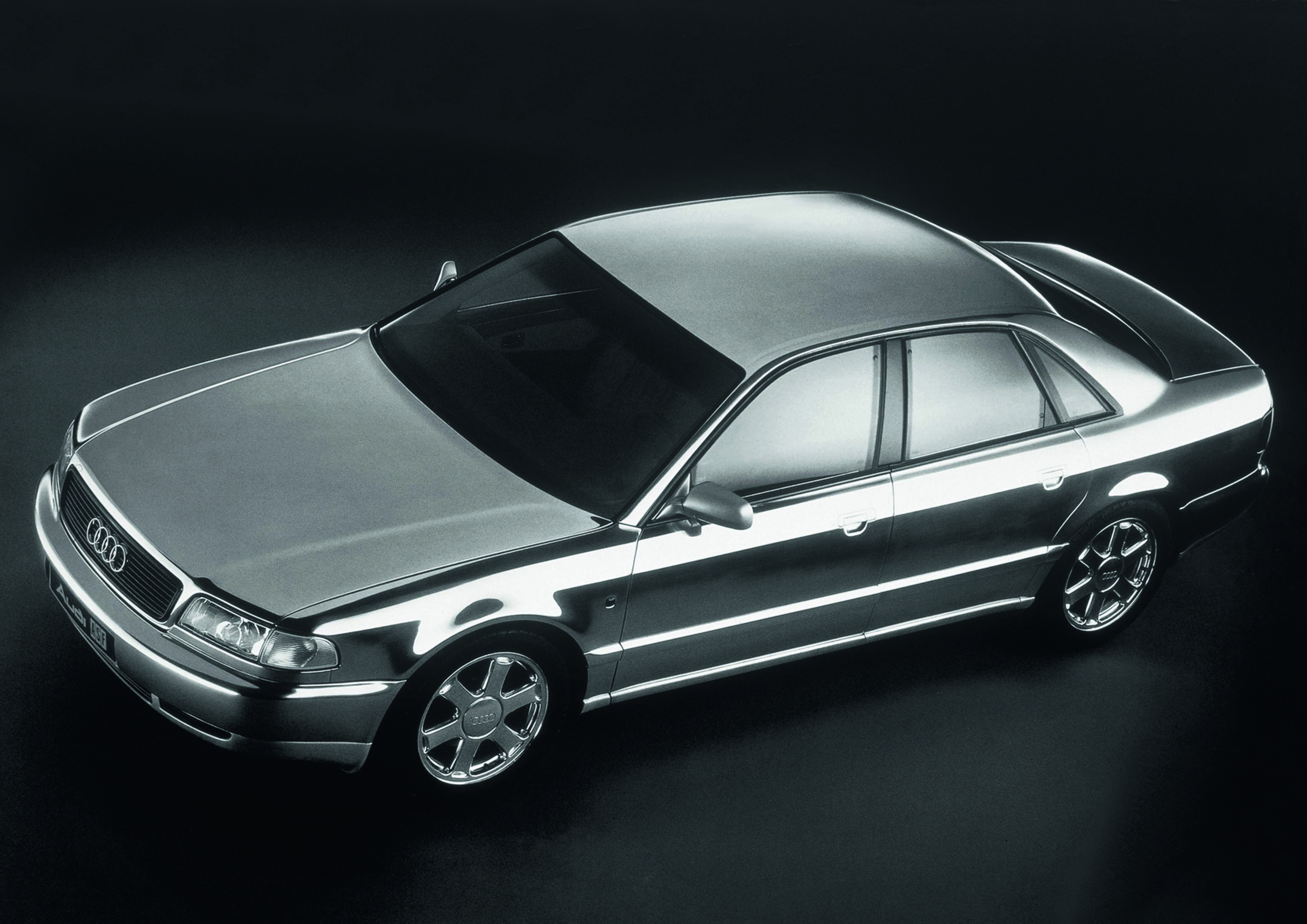 Anniversary magazine Design - Audi A8 - The luxury saloon with refined styling was launched in early 1994. At the previous IAA, Audi had presented the close-to-production ASF concept with a bodyshell made from mirror-finish aluminium.