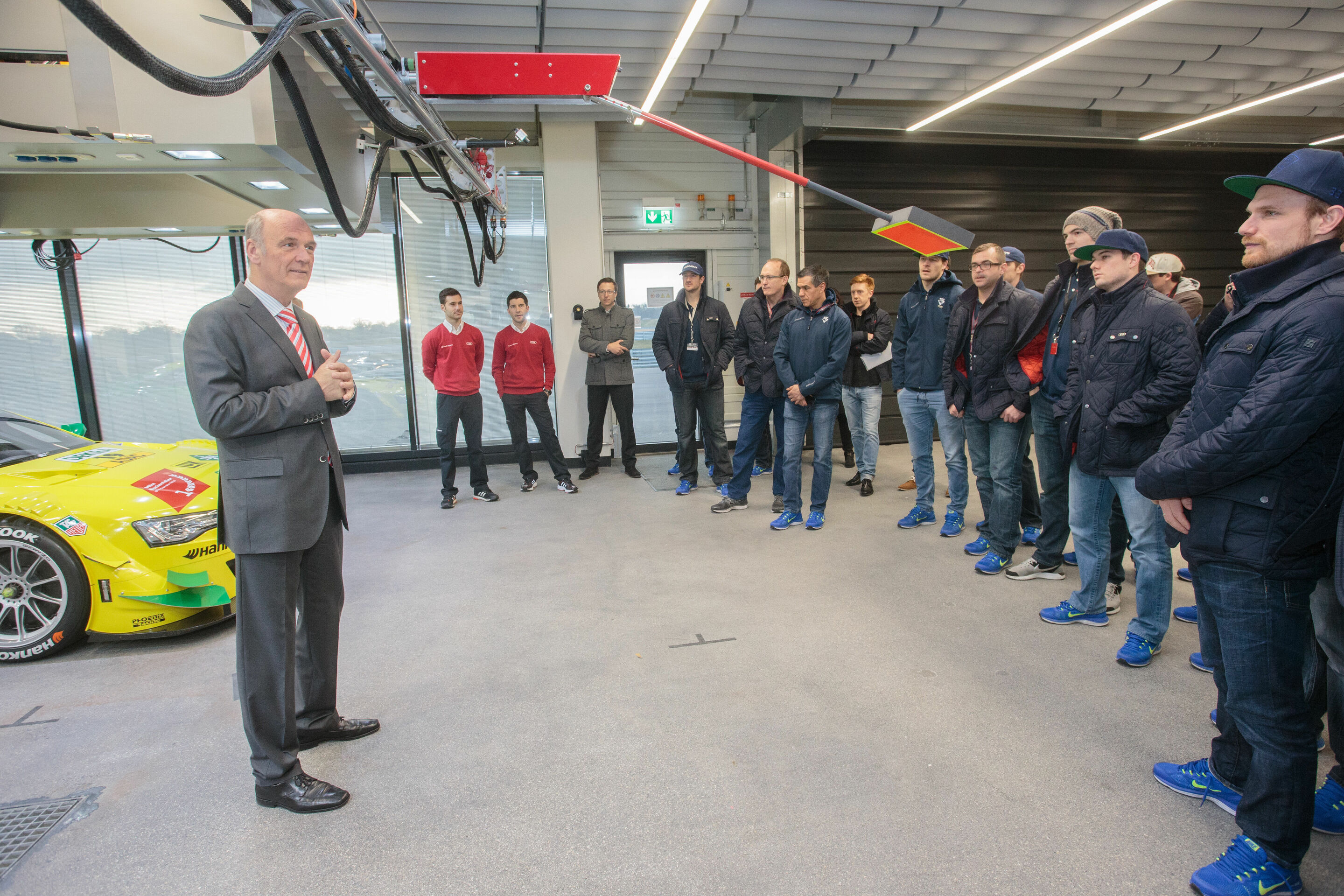 DTM 2015 Various - Head of Audi Motorsport Dr. Wolfgang Ullrich shows the Audi RS 5 DTM to players of ERC Ingolstadt