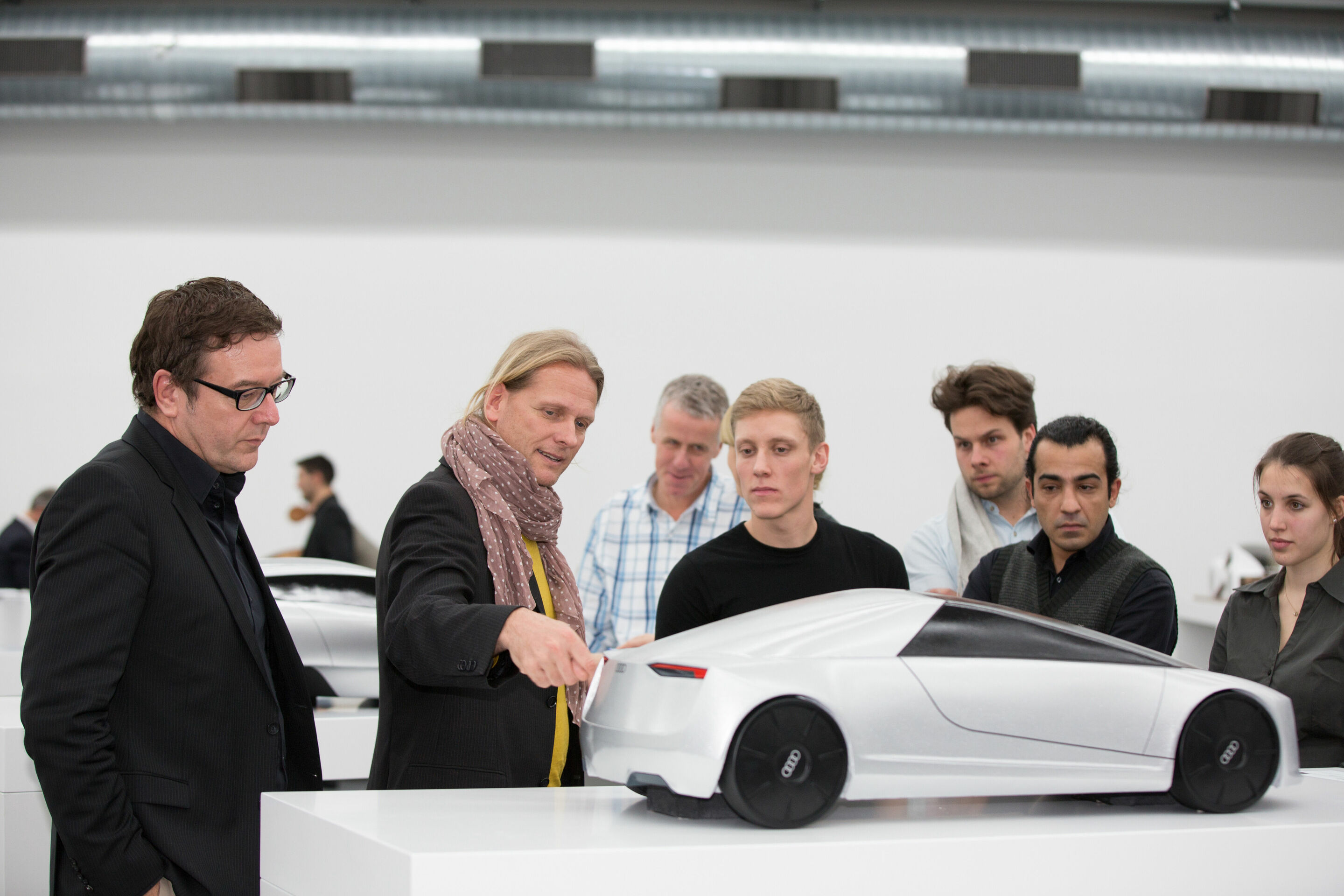 Audi Hosts Design Universities - Sharing creative ideas in the Audi Design UNIverse: at the University of Art and Design Offenbach, Head of Exterior Design Achim Badstübner discusses a model from the cooperative “Dream Car” project with students and a...