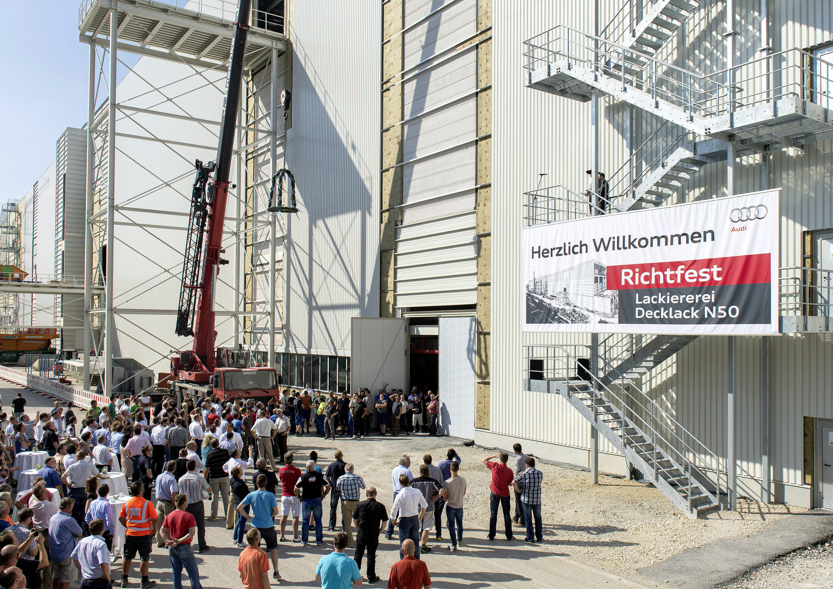 Audi celebrates topping out of new paint shop - A new topcoat paint line is being built in the north of the plant site in Ingolstadt. It will be one of the most environmentally friendly paint shops in the world. As of June 2016, Audi employees will paint...