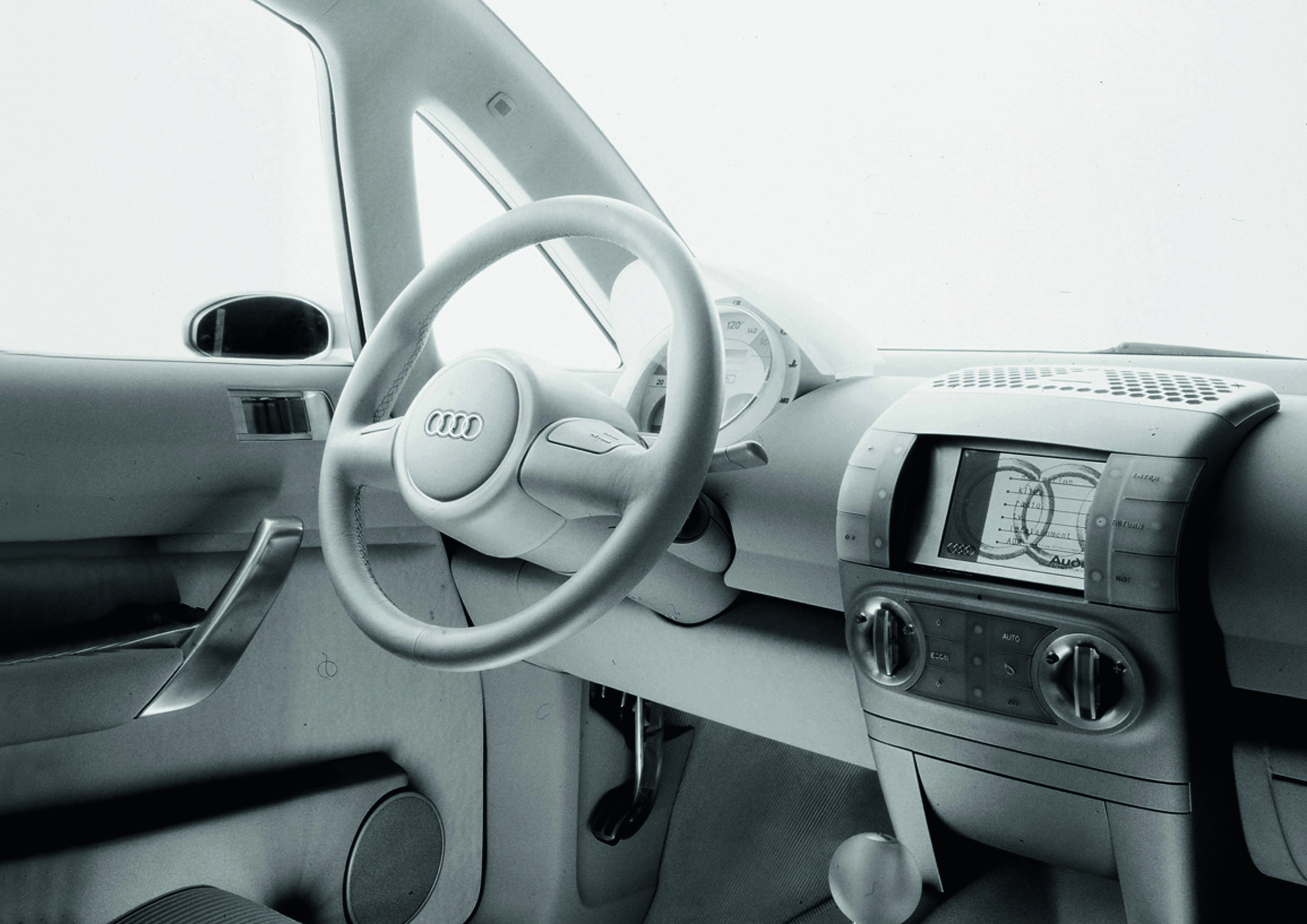 Anniversary magazine Design - The showcar Audi AI2 with a fixed roof and transparent interior ("Light Green") was the star of the 1999 IAA.
