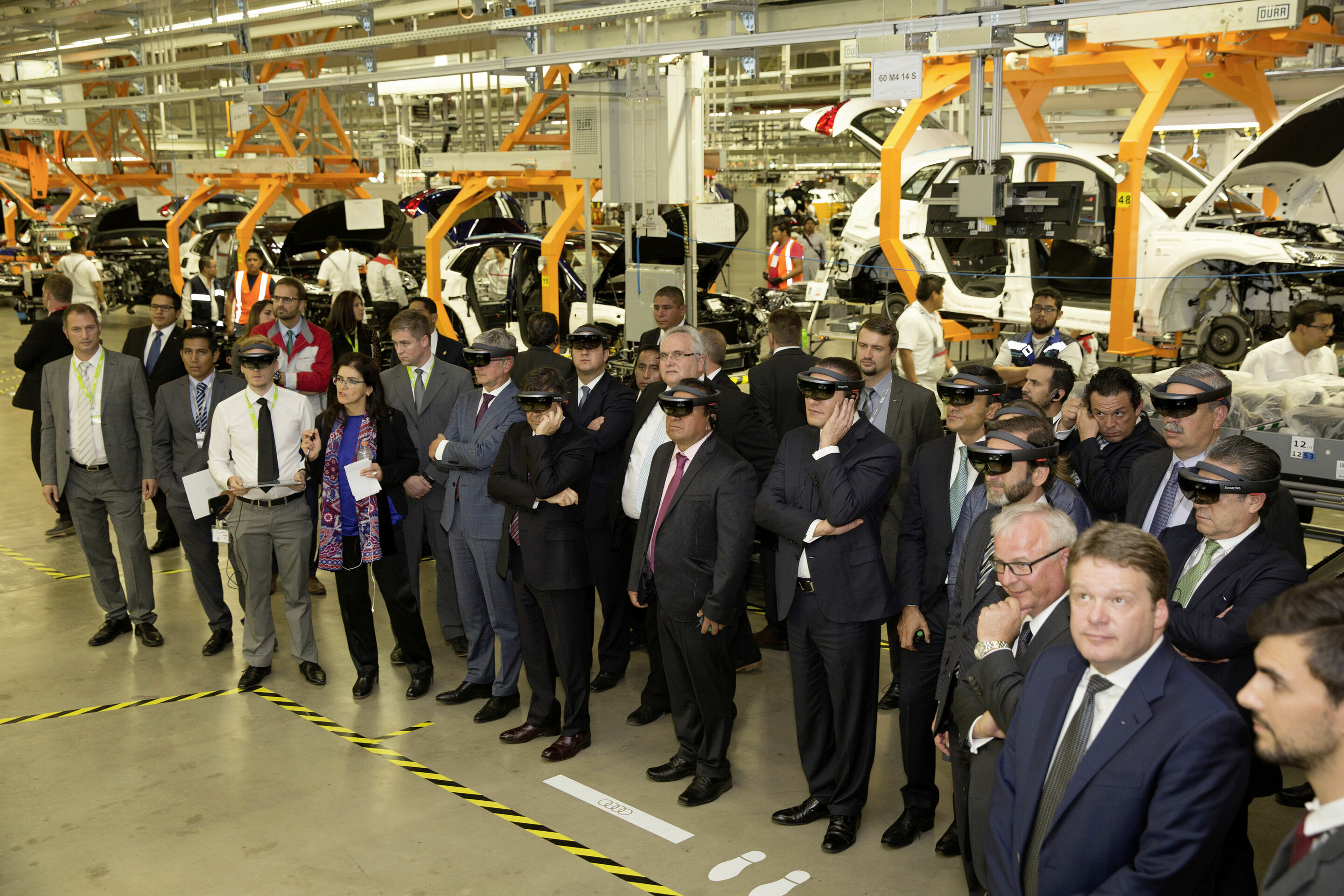AUDI AG opens automobile plant in Mexico - Audi Mexiko: The guests of the inauguration of the Audi plant during a tour through Assembly with HoloLenses. © AUDI AG