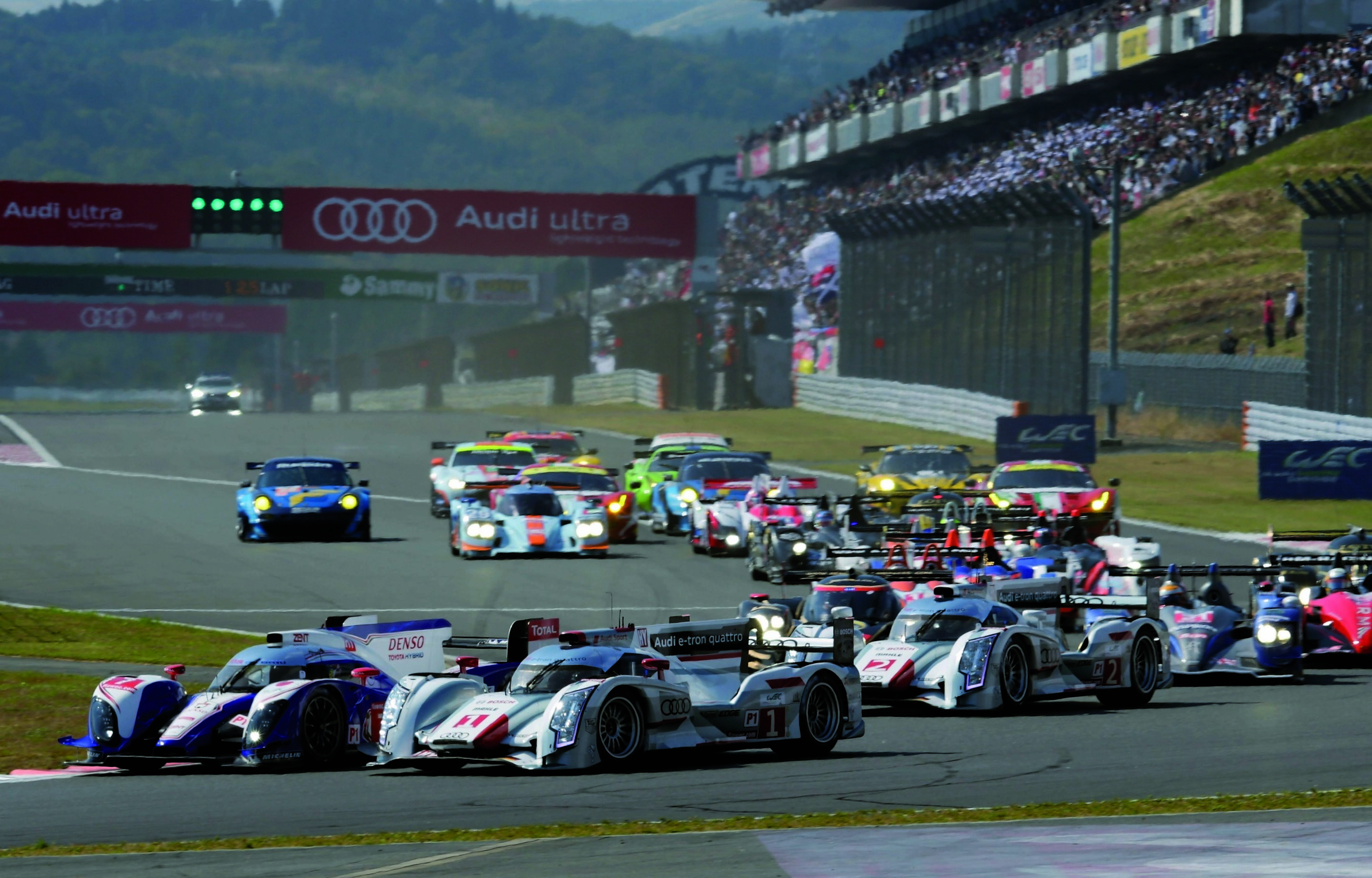 Audi belegt zwei Podiumsplätze in Japan - Audi musste sich im siebten Lauf zur FIA Langstrecken-Weltmeisterschaft WEC mit den Rängen zwei und drei begnügen. Eine Sportstrafe brachte den Audi R18 e-tron quattro Startnummer „1“ in Fuji um alle Chancen auf...