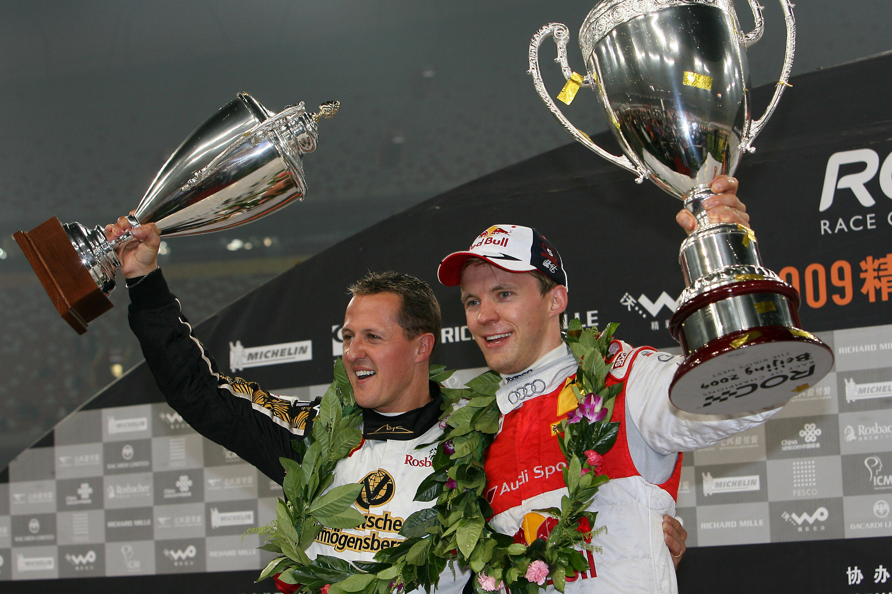 Race of Champions 2009 - Mattias Ekström (right) with Michael Schumacher on the podium of the 2009 Race of Champions