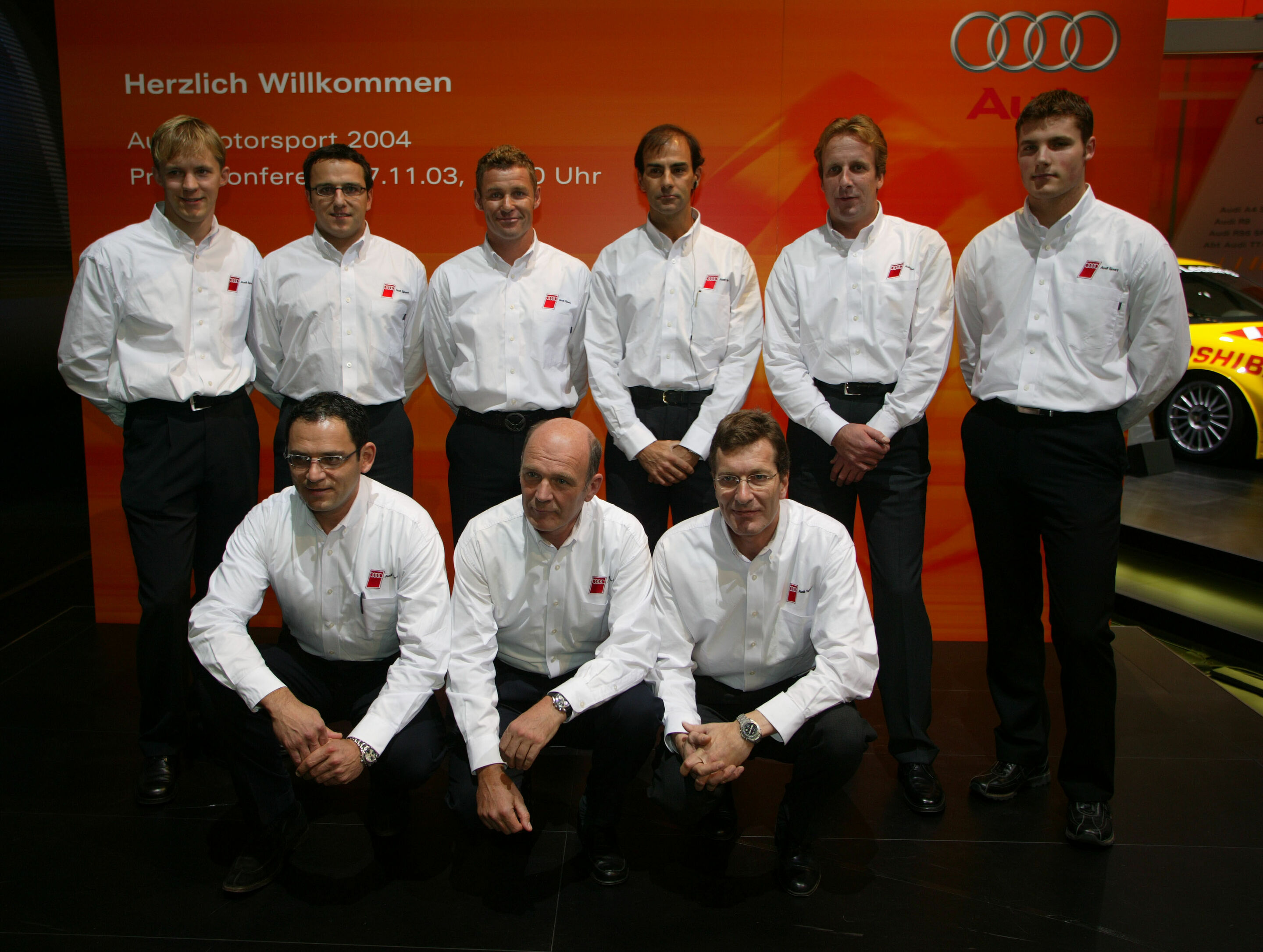 DTM 2004 - The Audi Teams for 2004): Mattias Ekström, Christian Abt, Martin Tomczyk, Emanuele Pirro, Frank Biela, Martin Tomczyk, Hans-Jürgen Abt, Audi Sportchef Dr. Wolfgang Ullrich, Ralf Jüttner