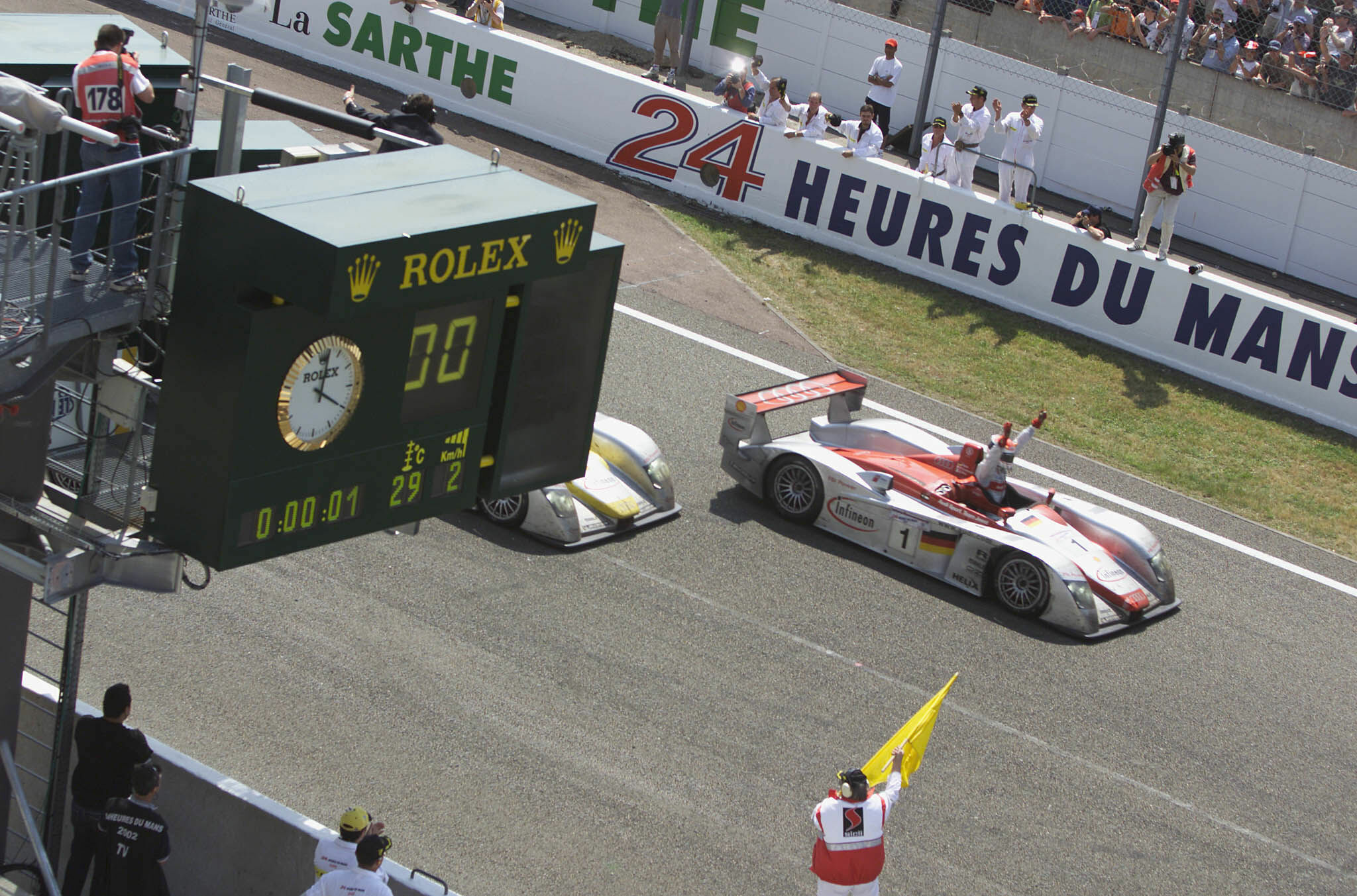 Le Mans 2002 - After 24 hours at Le Mans Emanuele Pirro crosses the finish line first
