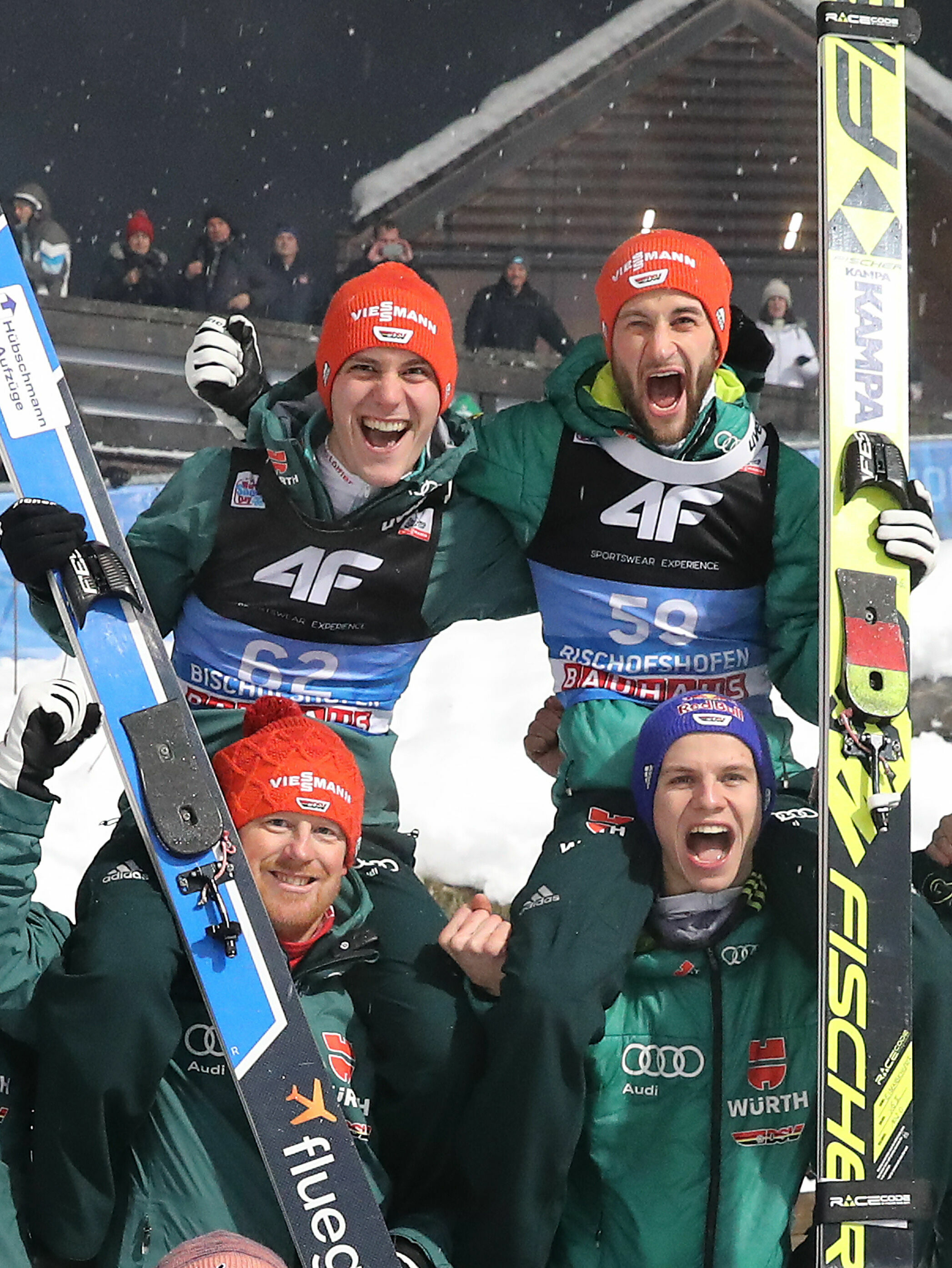 67th Four Hills Tournament - Epiphany Ski Jump in Bischofshofen - 2nd overall place Markus Eisenbichler (GER) and 3rd overall place Stephan Leihe (GER) on the shoulders of their teammates