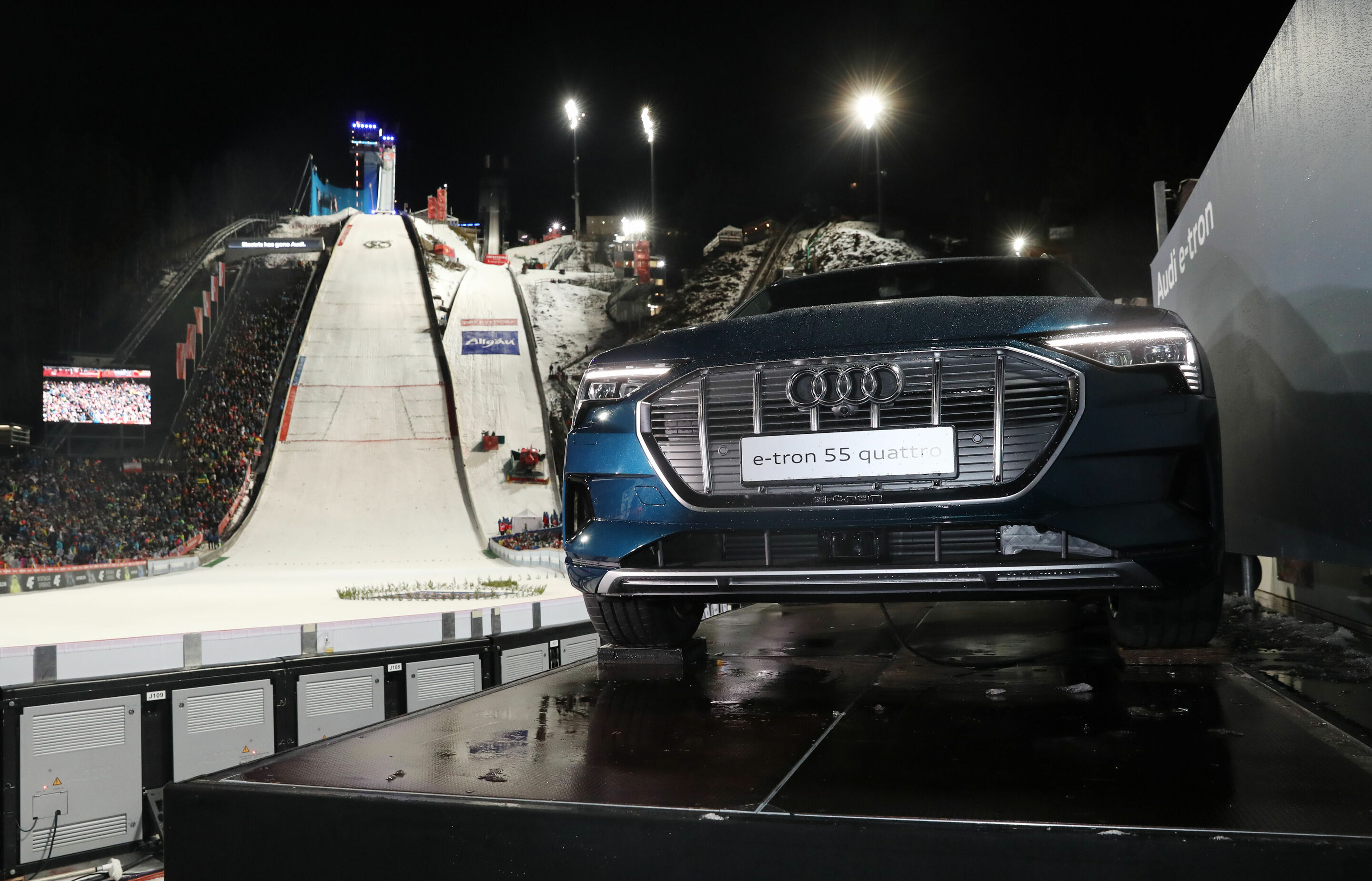 67th Four Hills Tournament - Opening Jumping in Oberstdorf - Audi e-tron 55 quattro besides the ski jump in Oberstdorf