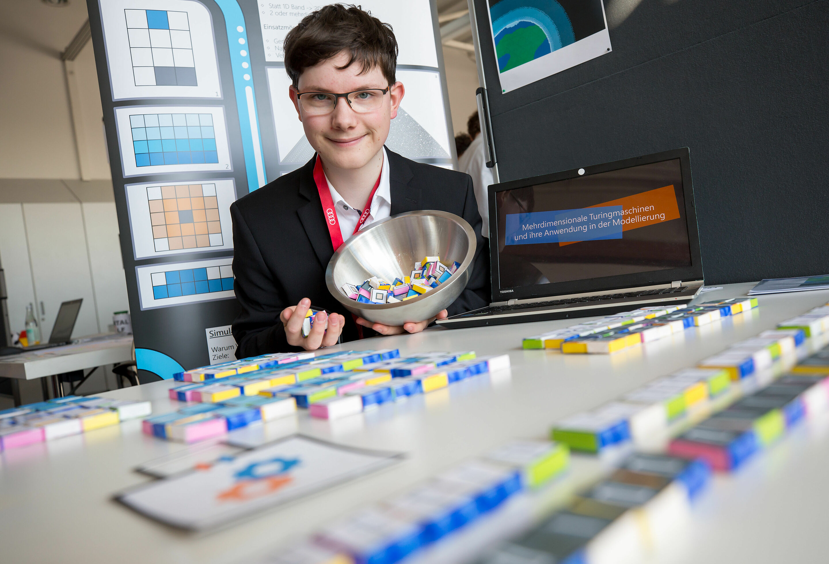 Challenge for young inventors from Bavaria at Audi - Raphael Kunert from the Werner-von-Siemens-Gymnasium Regensburg (high school) explored the useful modelling of a multidimensional turing machine. He presented his project in the faculty of Mathematics...