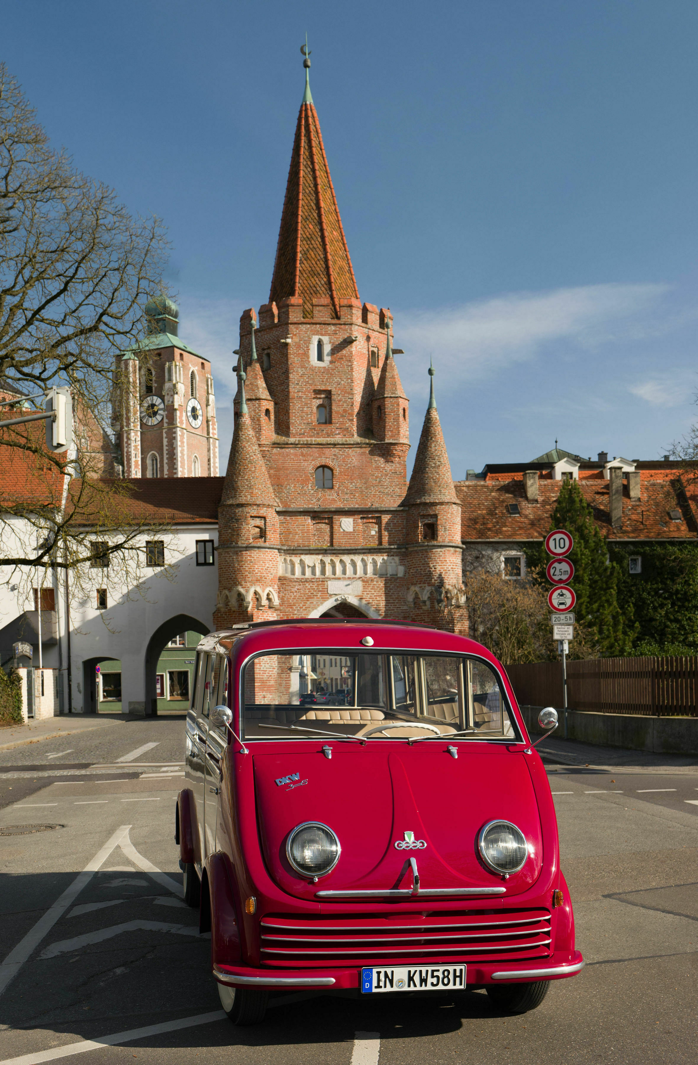 70 Years Anniversary Audi Ingolstadt - The DKW F 800/3 Schnelllaster luxury bus in front of the Kreuztor, one of Ingolstadt's most important landmarks.