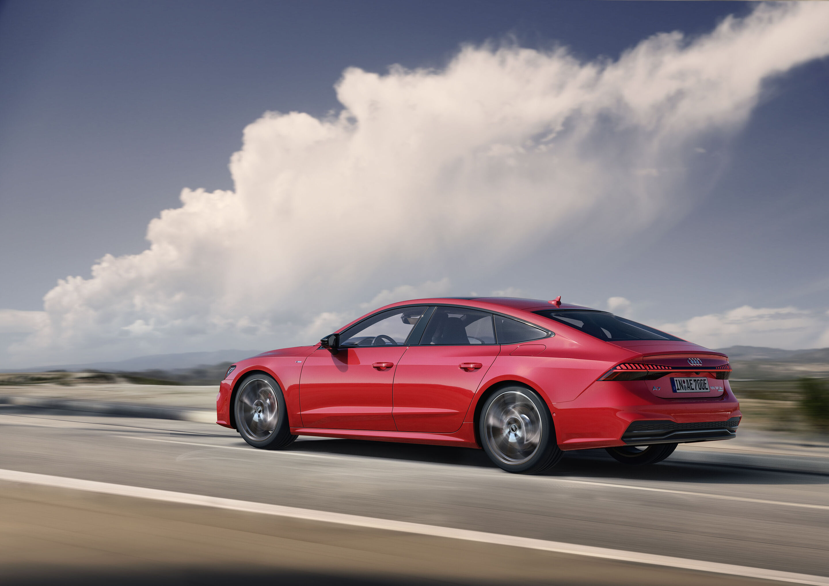 Audi A7 Sportback 55 TFSI e quattro (until 2025) - Dynamic photo, 
Colour: Tango red