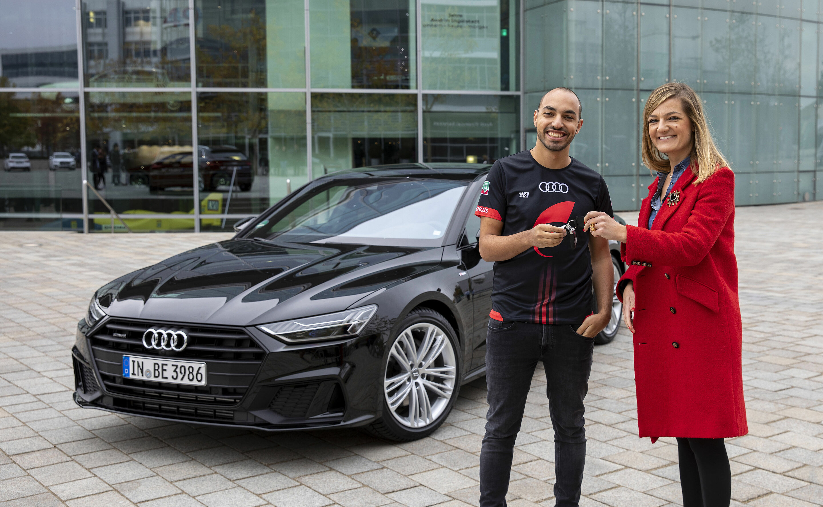 "Beat the Pro" event with "FOKUS CLAN" players Mohammed "MoAuba" Harkous and Matthias "Stylo" Hietsch - Mohammed "MoAuba" Harkous at the handover of the Audi A7 with Ana Andrijanic, Head of Event Strategy, Planning, New Expertal Formats AUDI AG