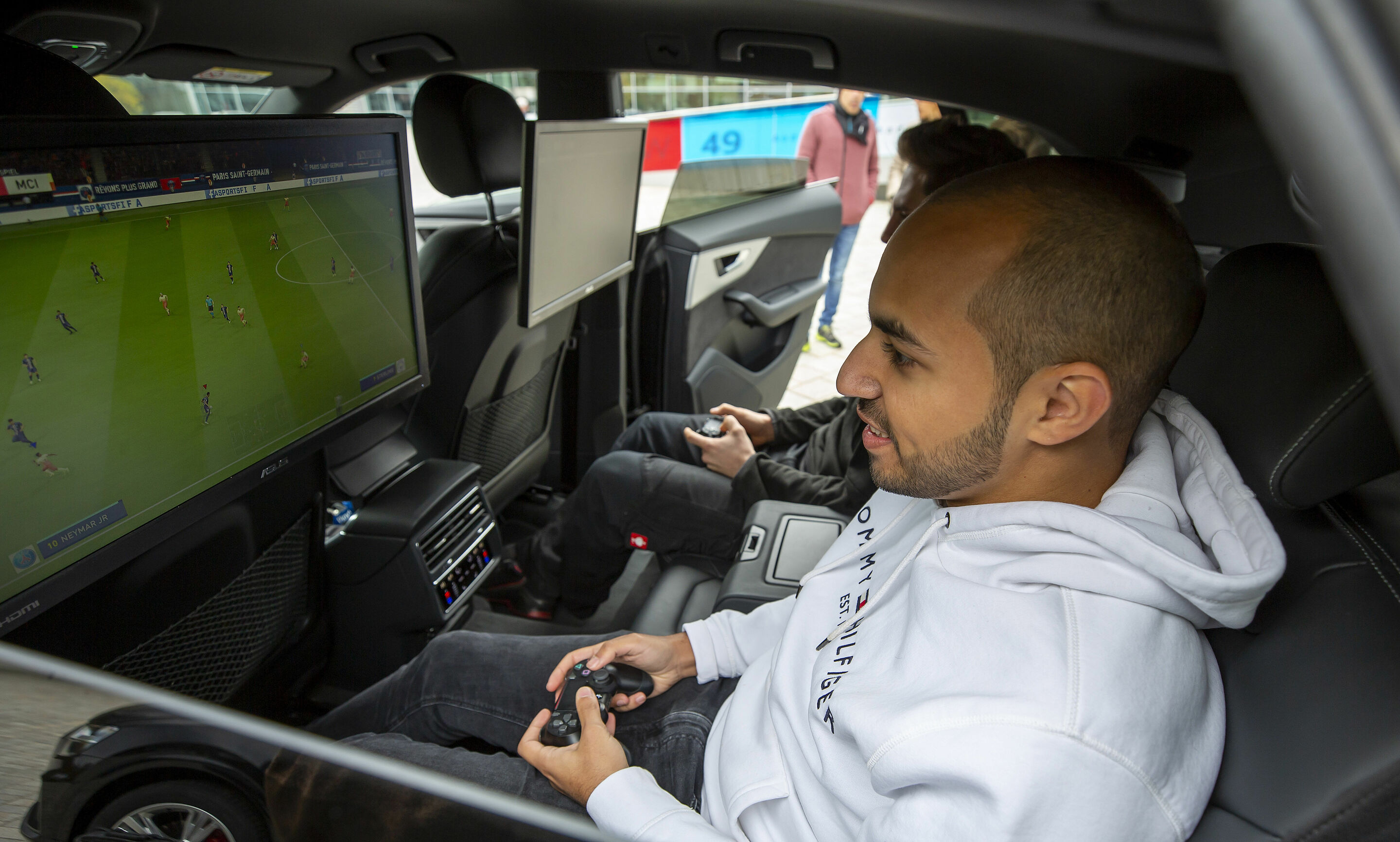 "Beat the Pro" event with "FOKUS CLAN" players Mohammed "MoAuba" Harkous and Matthias "Stylo" Hietsch - Mohammed "MoAuba" Harkous playing Fifa in the Audi Q8