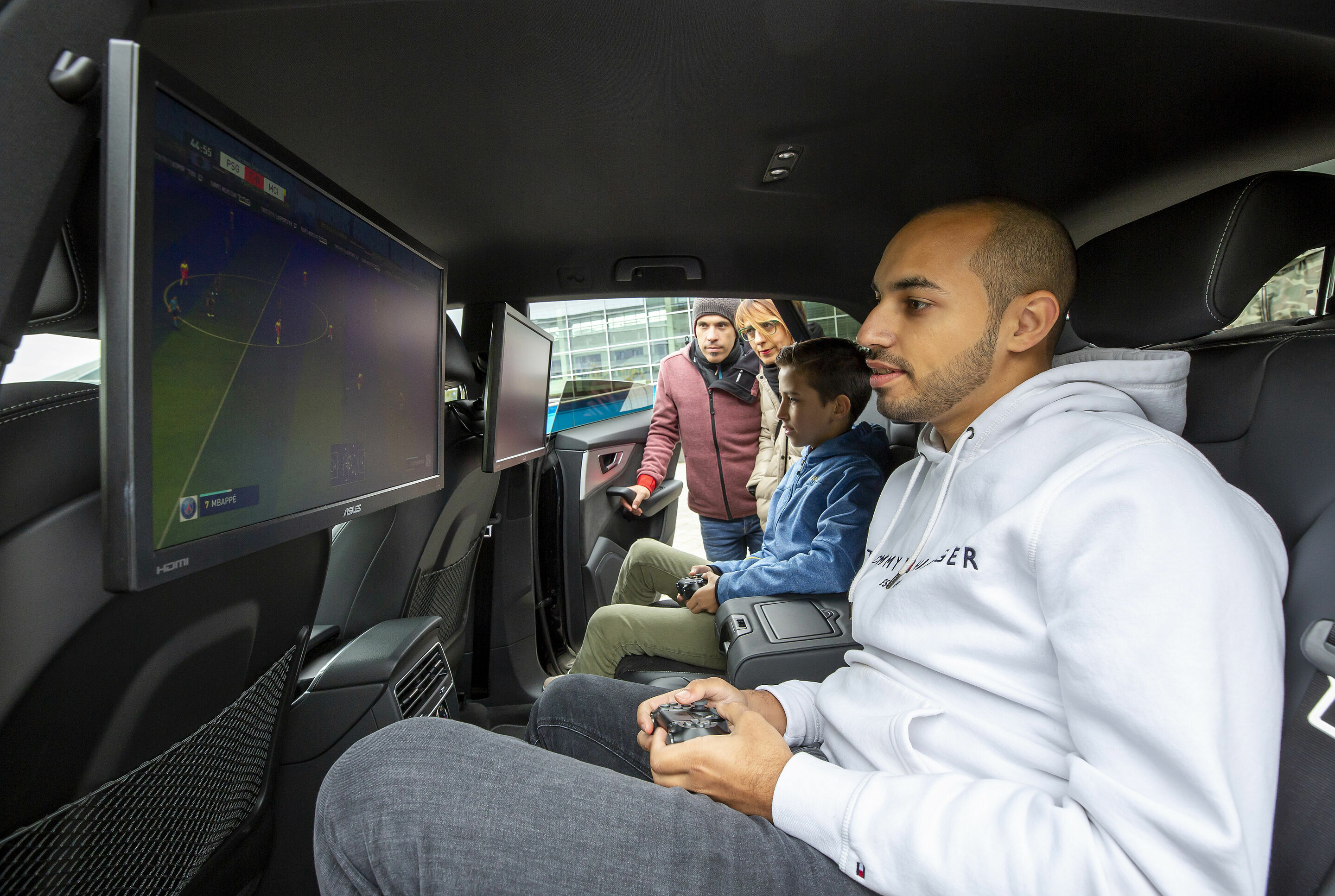 "Beat the Pro" event with "FOKUS CLAN" players Mohammed "MoAuba" Harkous and Matthias "Stylo" Hietsch - Mohammed "MoAuba" Harkous playing Fifa in the Audi Q8