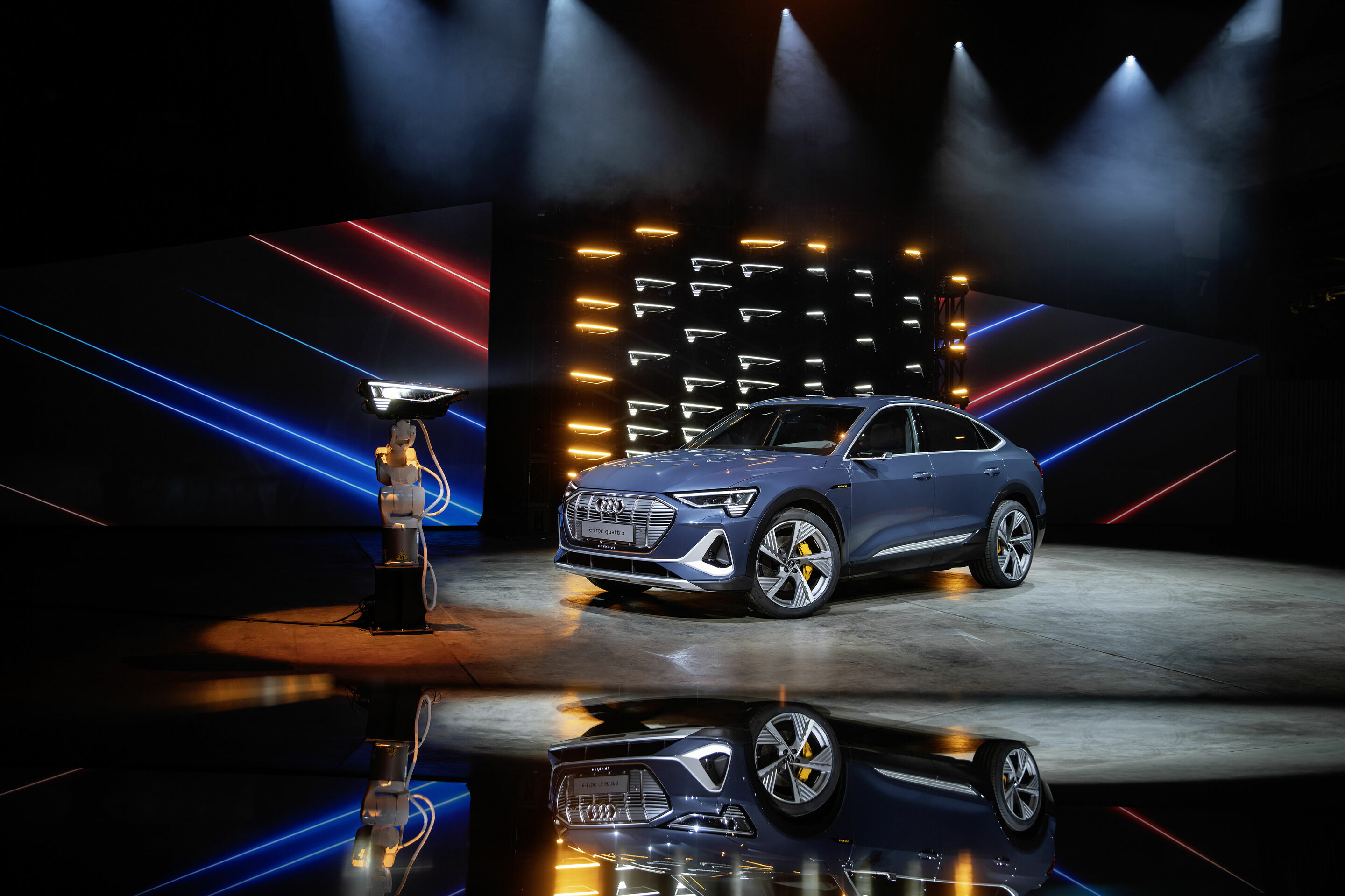 Audi e-tron Sportback 55 quattro - Static photo,
Colour: plasma Blue
„The displayed vehicle shows optional equipment at extra charge. Individual equipment will be available at a later date.”