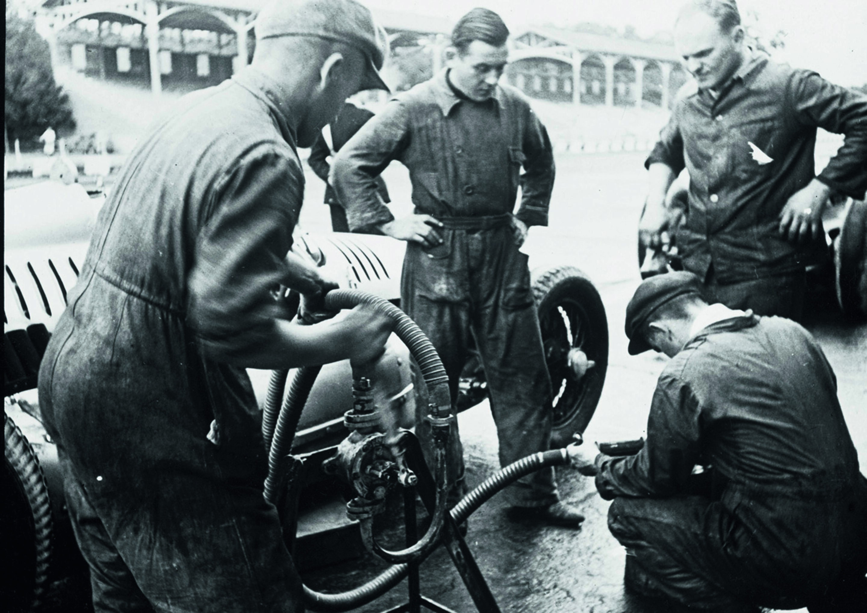 Anniversary magazine Motorsports - Auto Union refuelling equipment - pit stops were trained to perfection.
