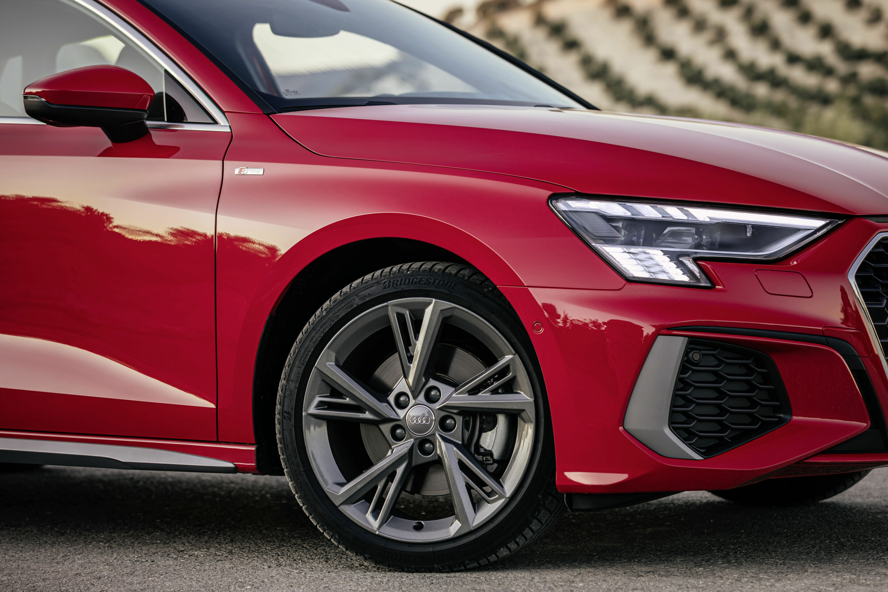 Audi A3 Sportback - Audi A3 Sportback with Matrix LED headlights and digital daytime running lights. Static photo, colour: tango red
