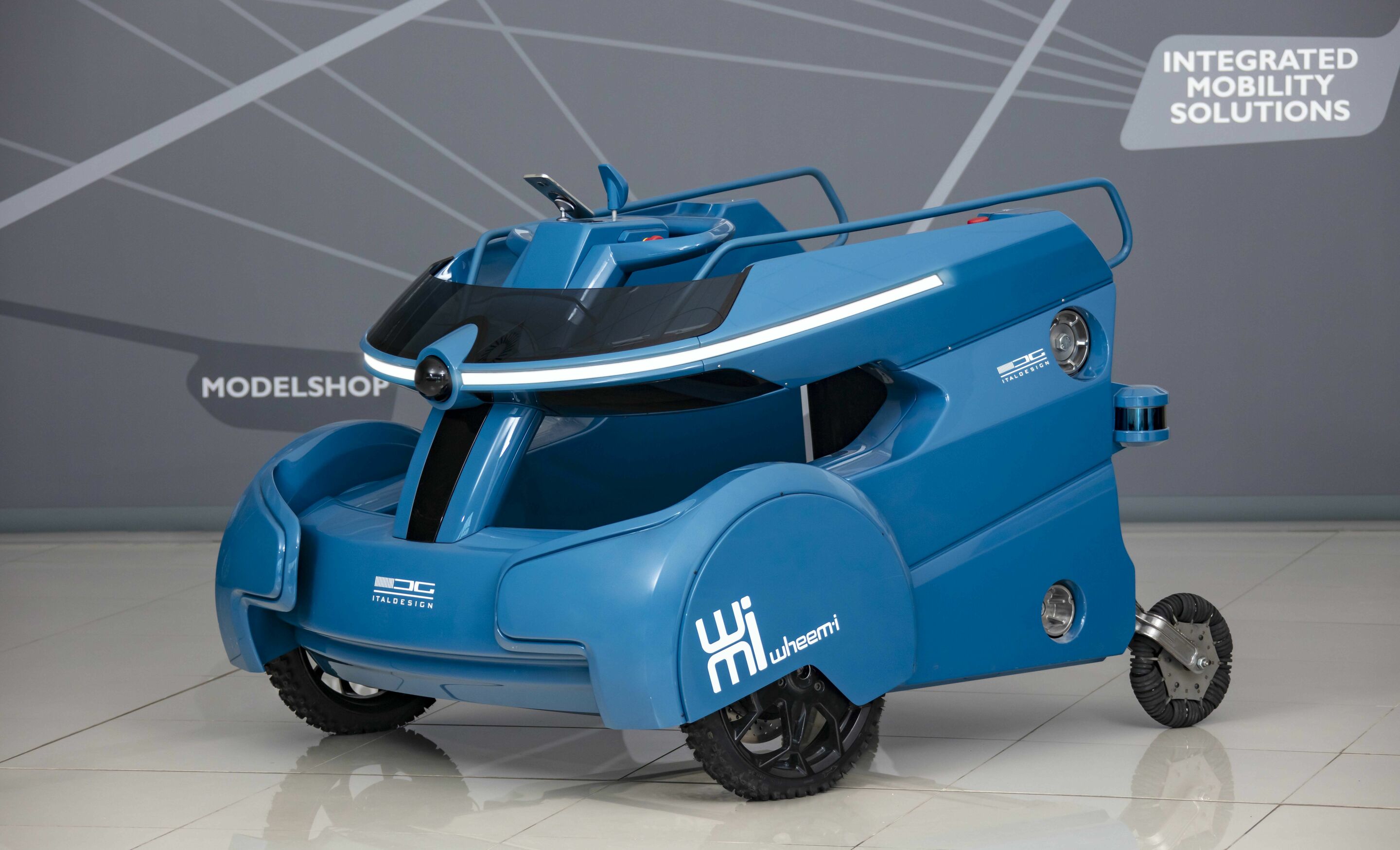 Italdesign Giugiaro S.p.A. - Italdesign developed a wheelchair project for an inclusive service for disabled persons. Based on the idea of a sharable service, WheeM-I is an electric, semi-autonomous platform able to host a wheelchair to ease the navigation...